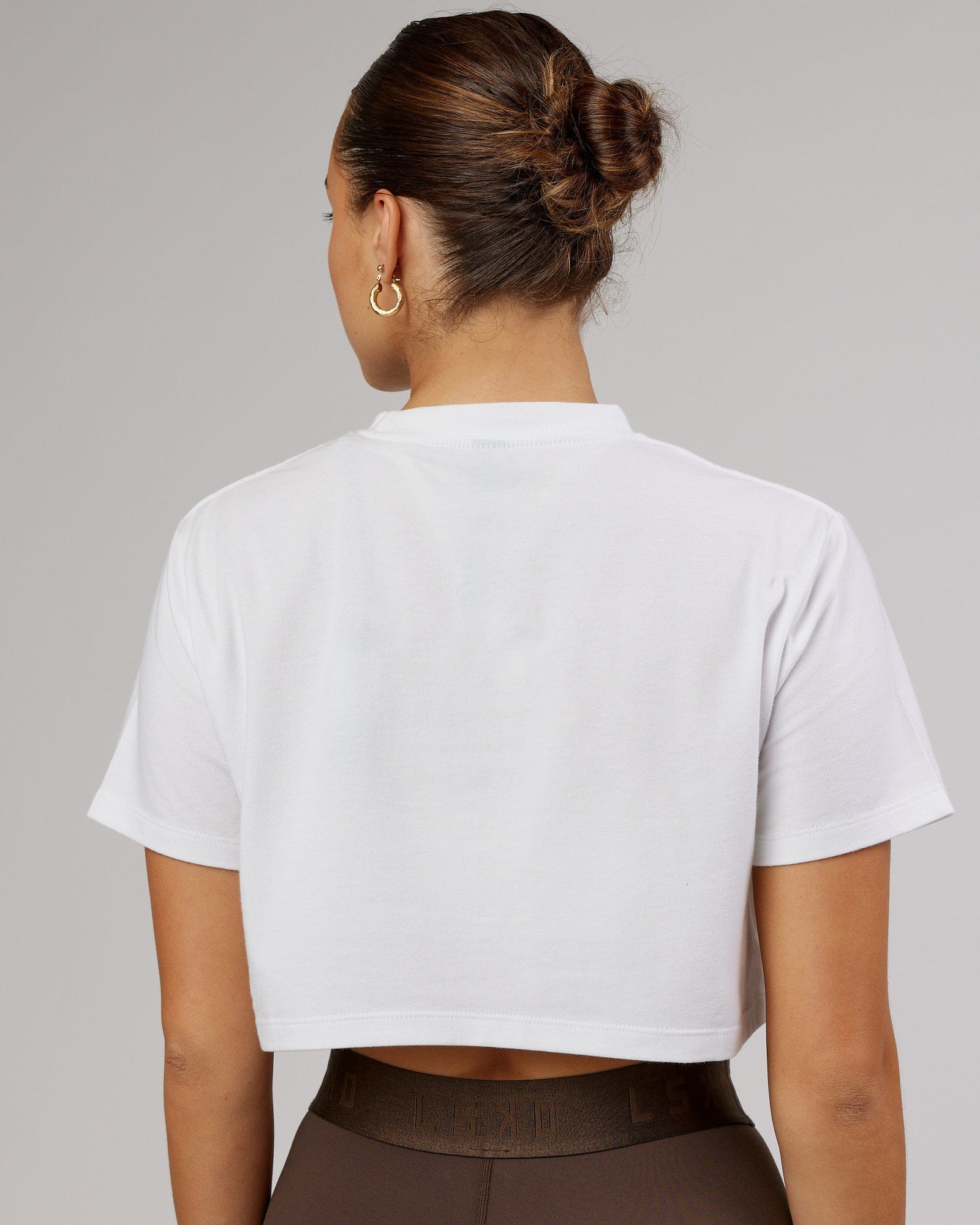 Model wearing Rapid FLXDRY Cropped Tee - White