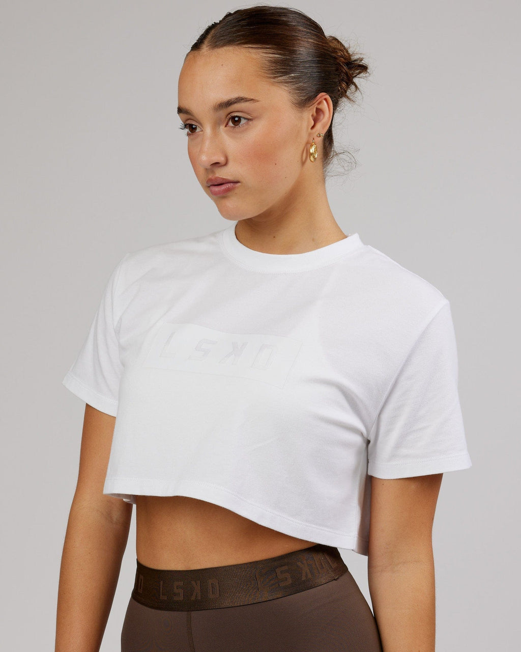 Model wearing Rapid FLXDRY Cropped Tee - White