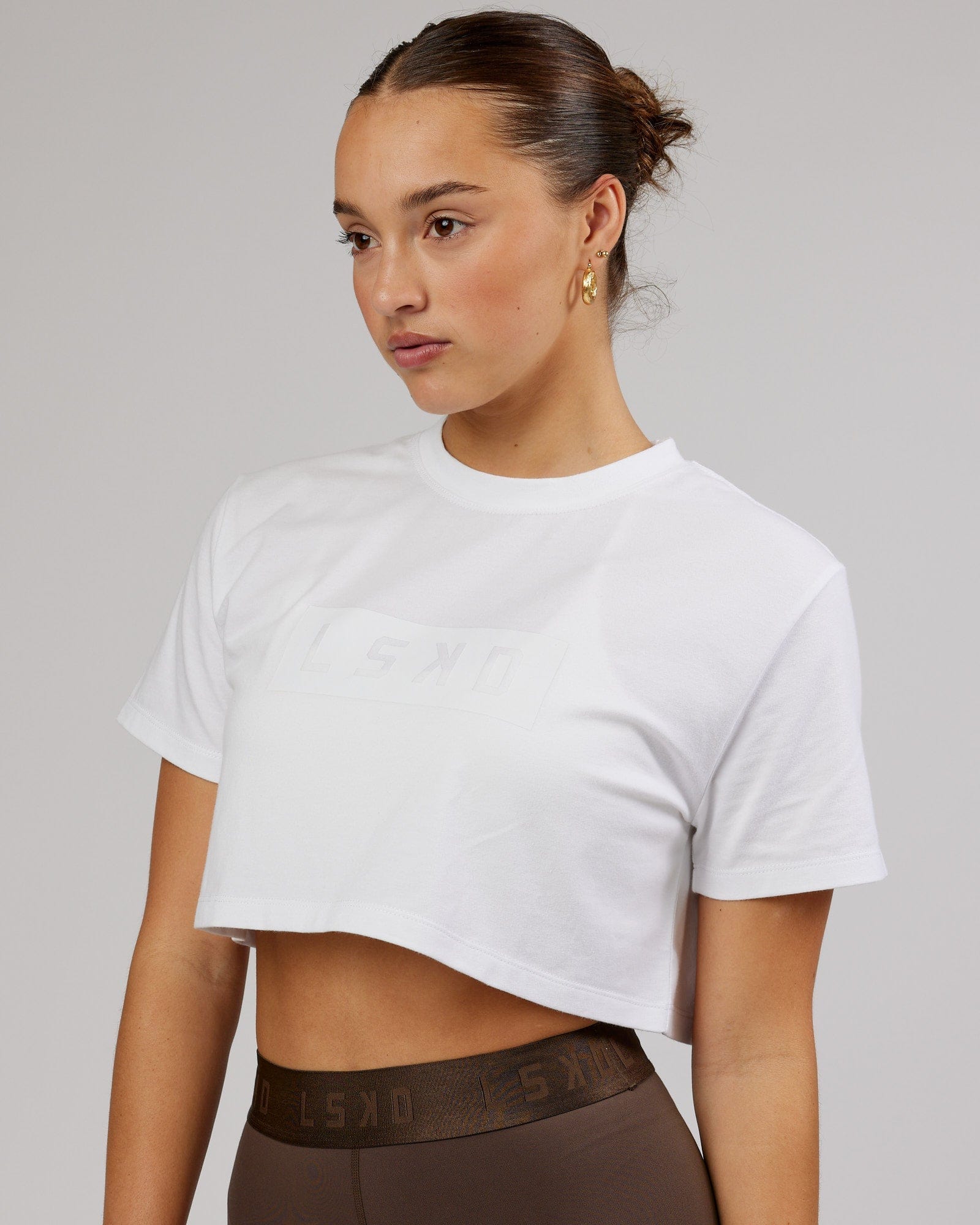 Model wearing Rapid FLXDRY Cropped Tee - White