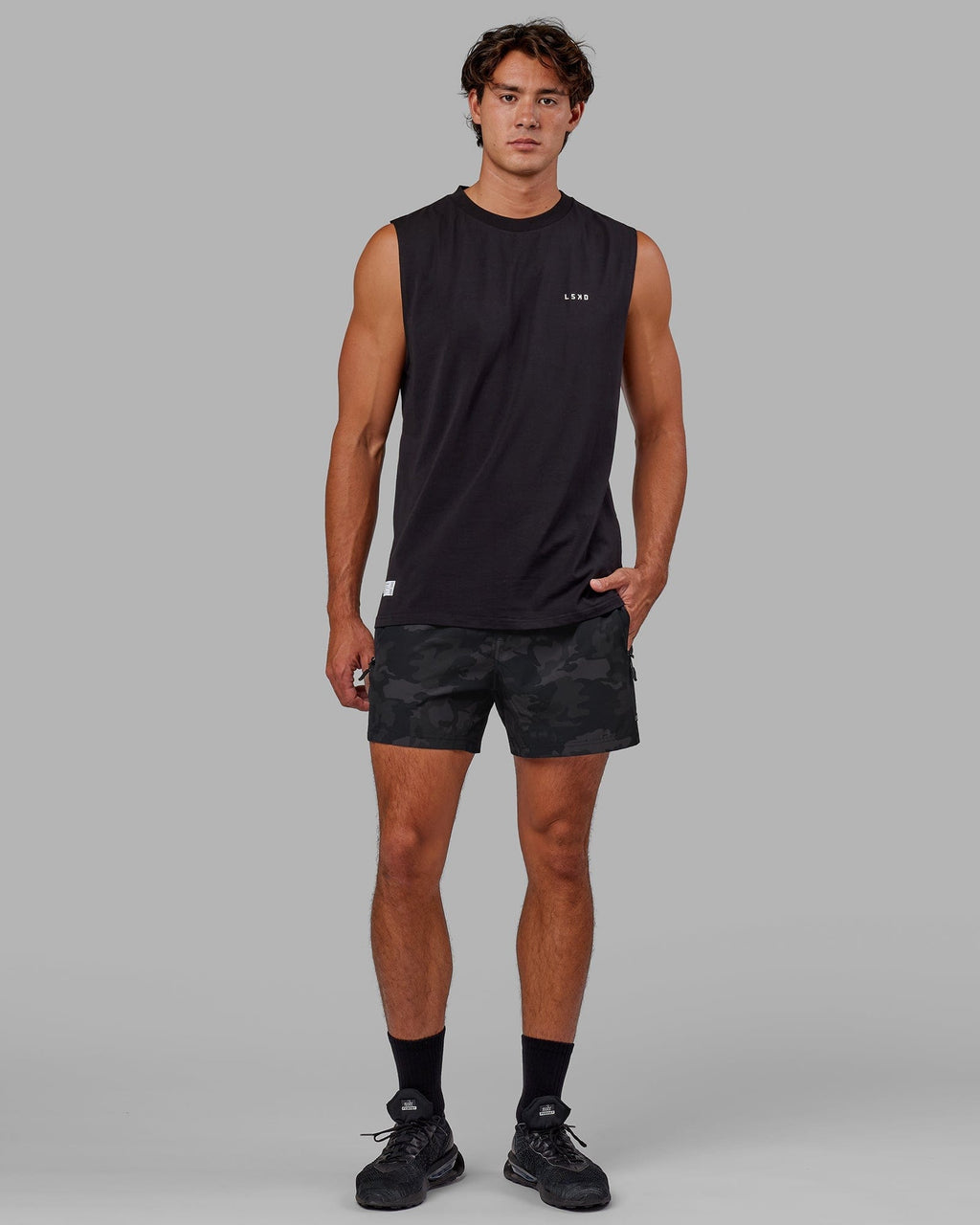 Model wearing Rep 5" Performance Short - Black Camo