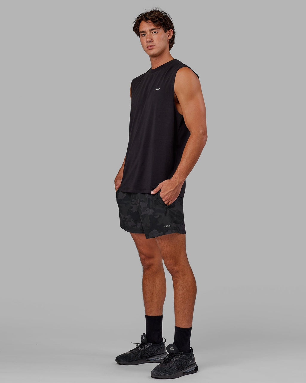 Model wearing Rep 5" Performance Short - Black Camo
