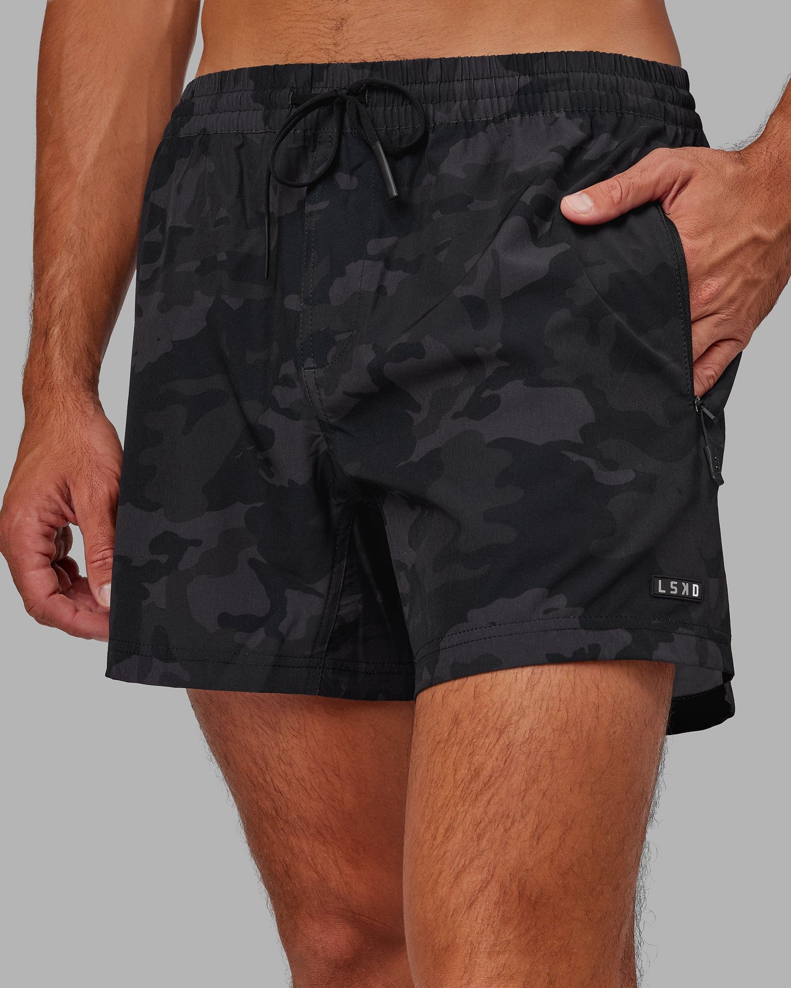 Model wearing Rep 5" Performance Short - Black Camo
