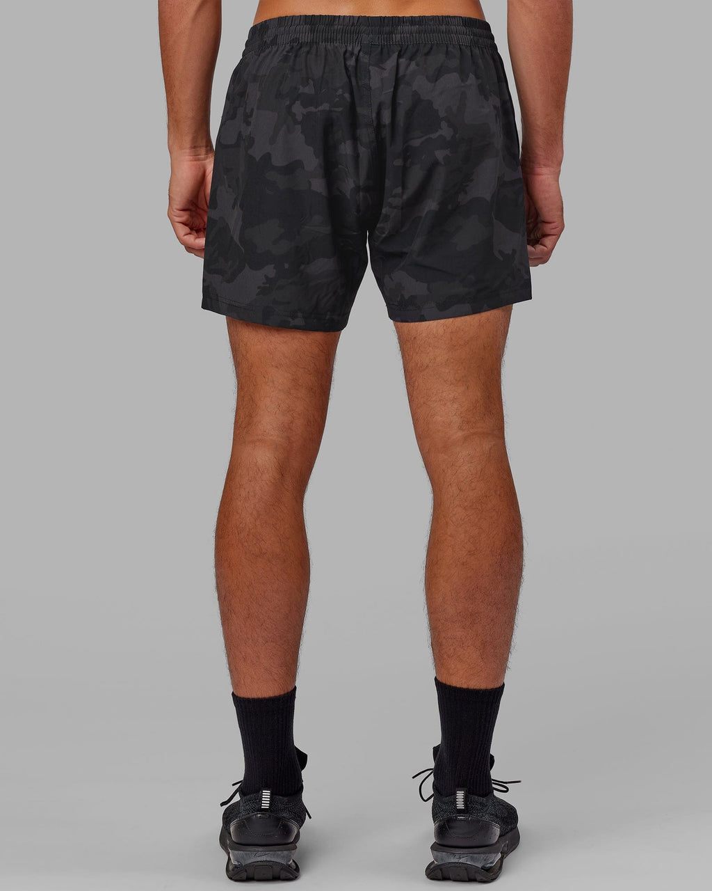 Model wearing Rep 5" Performance Short - Black Camo