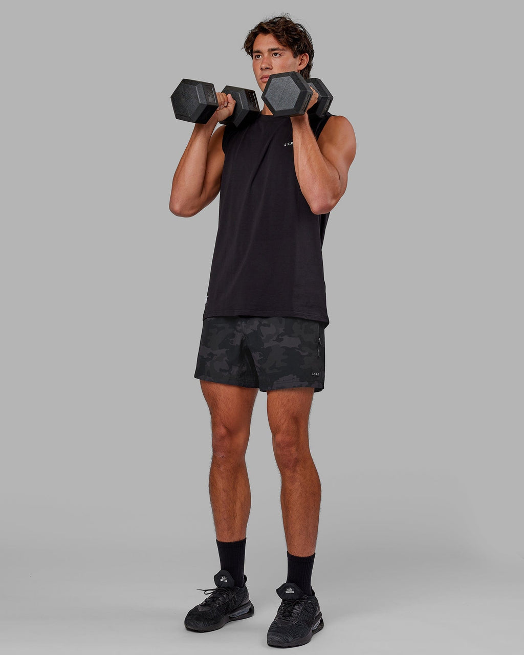 Model wearing Rep 5" Performance Short - Black Camo