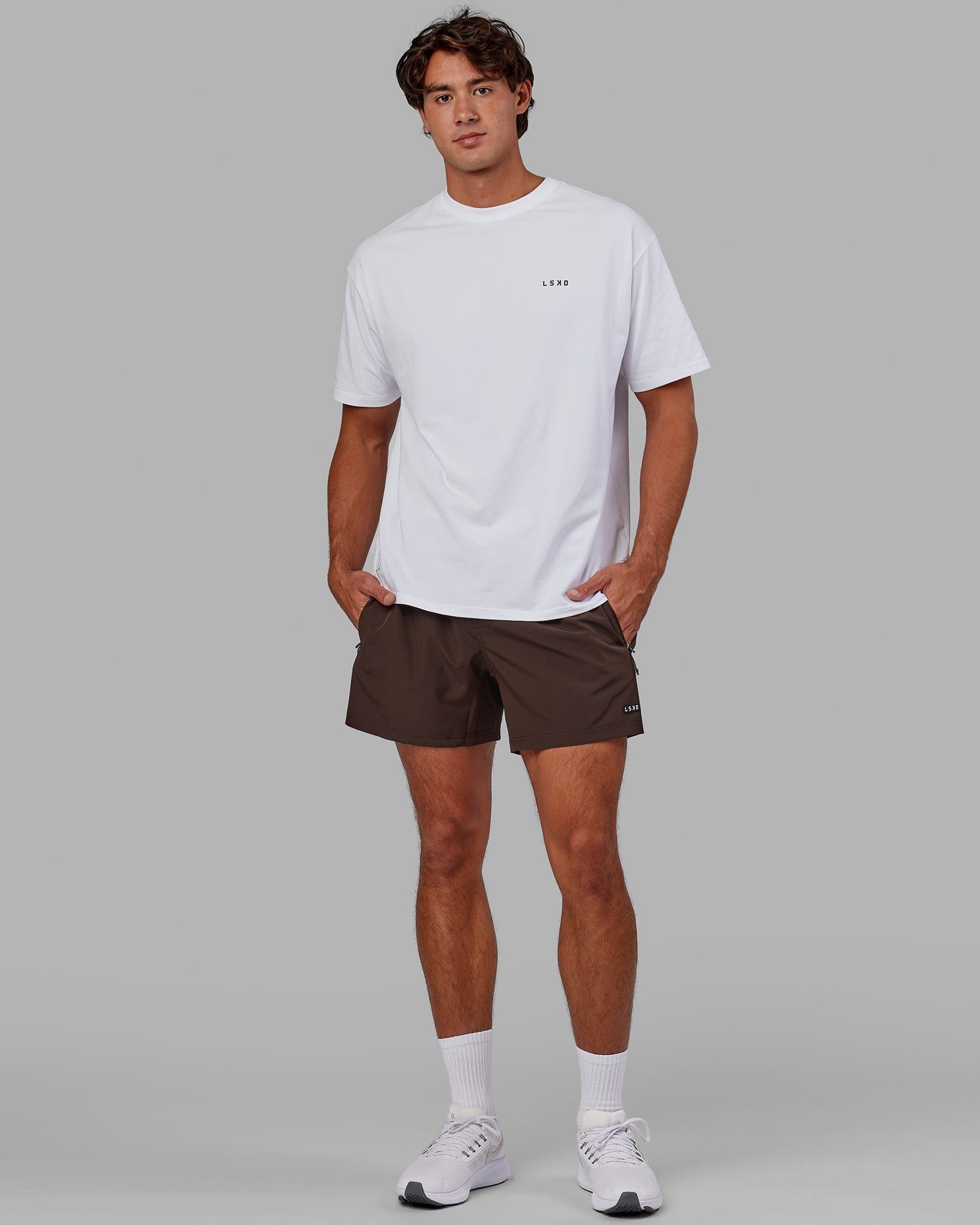 Model wearing Rep 5" Performance Short - Dark Chocolate