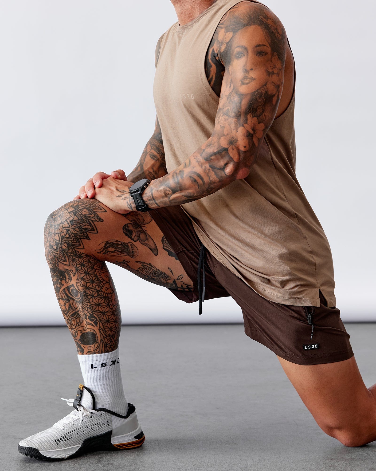 Model wearing Rep 5" Performance Short - Dark Chocolate