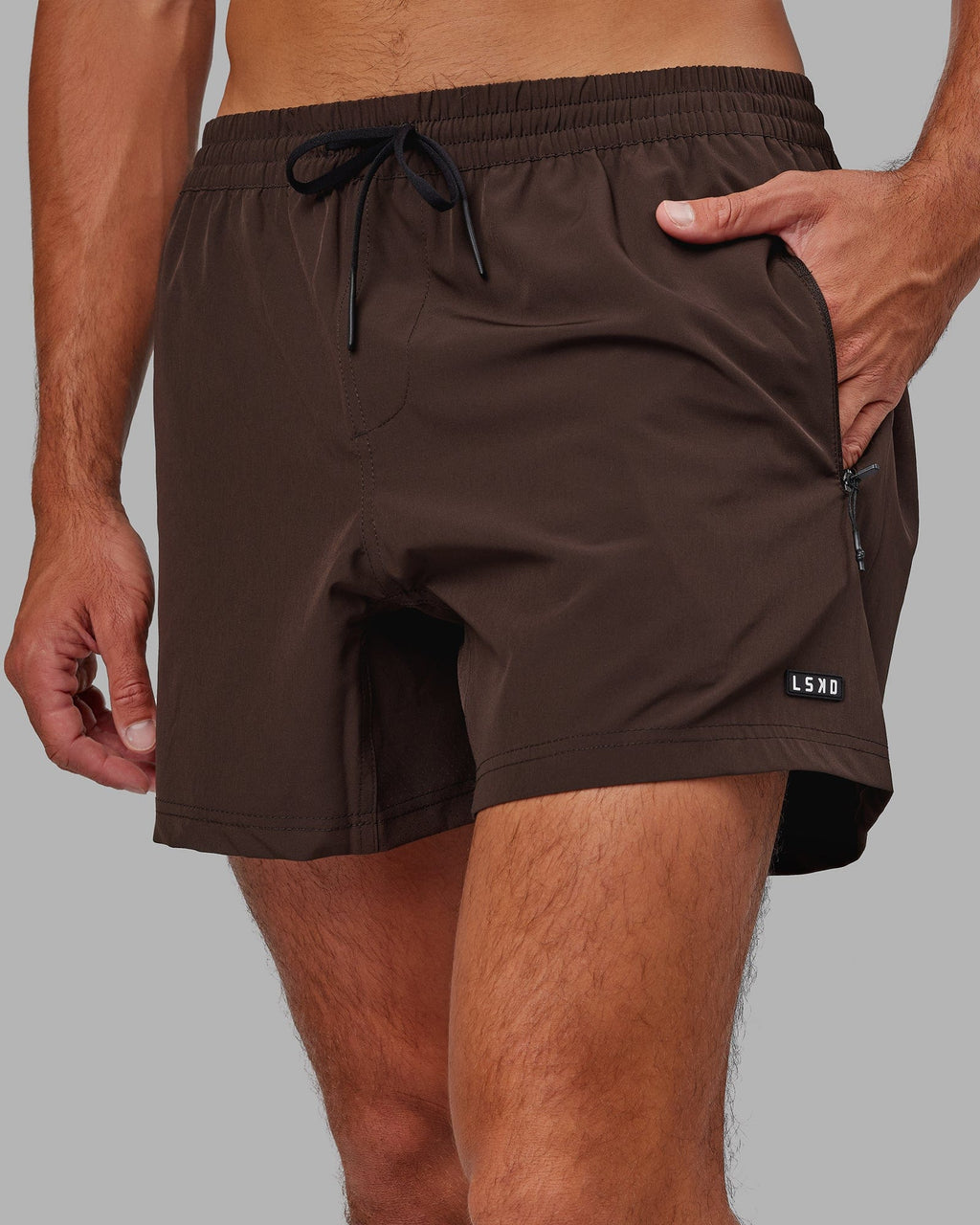 Model wearing Rep 5" Performance Short - Dark Chocolate