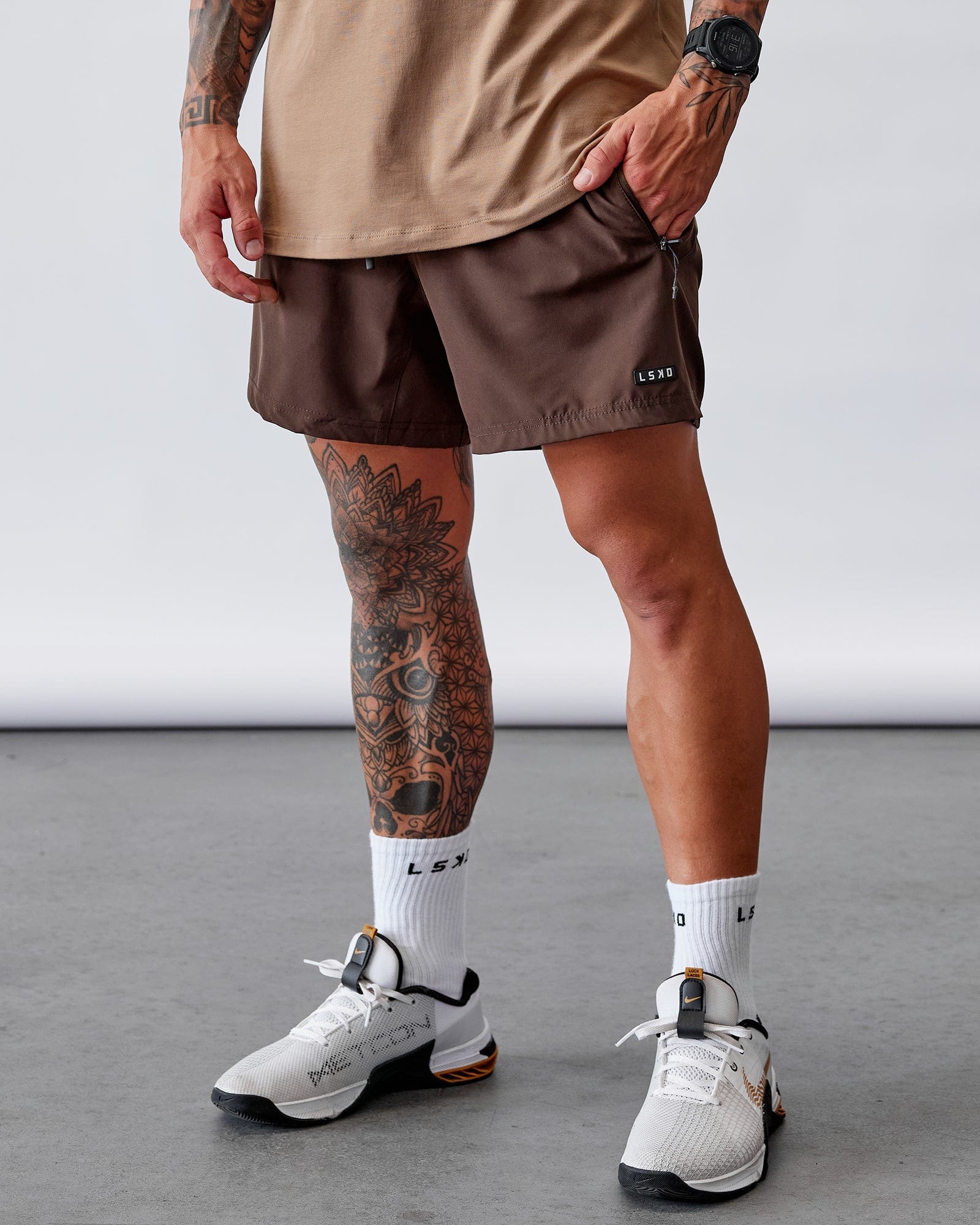 Model wearing Rep 5" Performance Short - Dark Chocolate