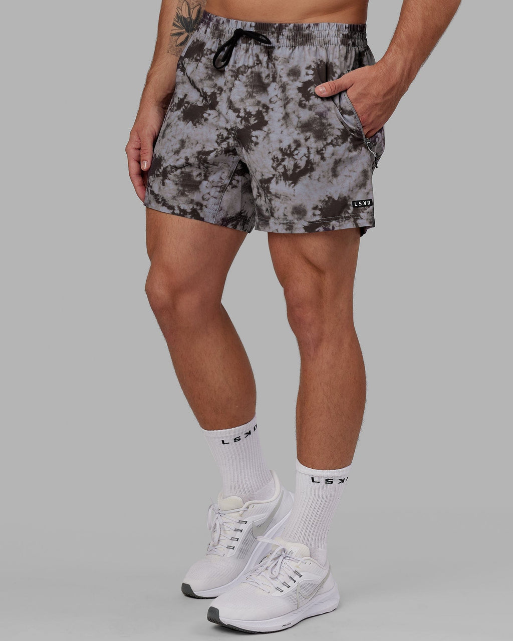 Model wearing Rep 5" Performance Short - Asphalt Tie Dye