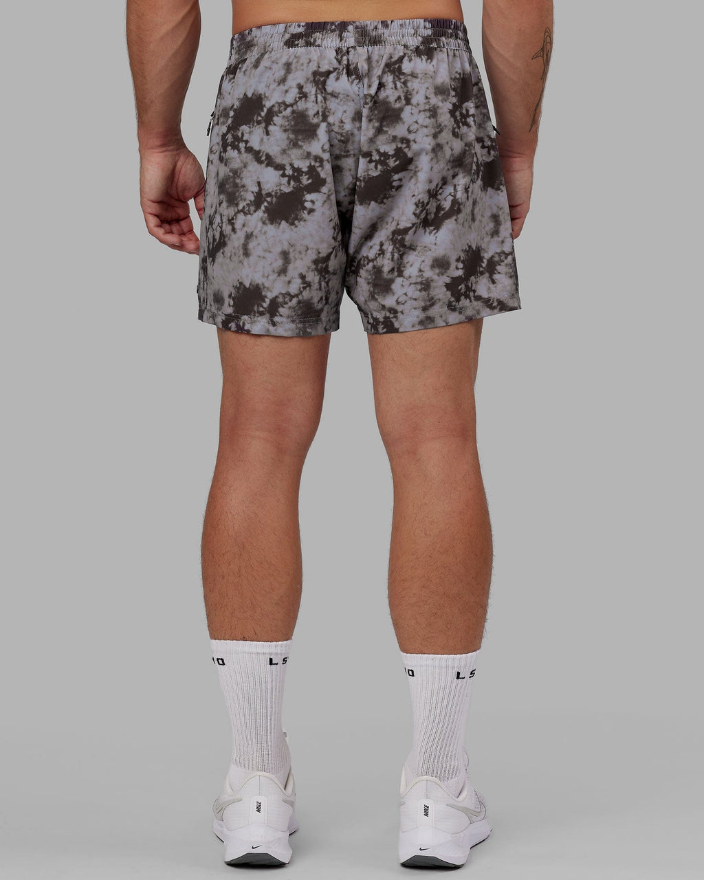 Model wearing Rep 5" Performance Short - Asphalt Tie Dye