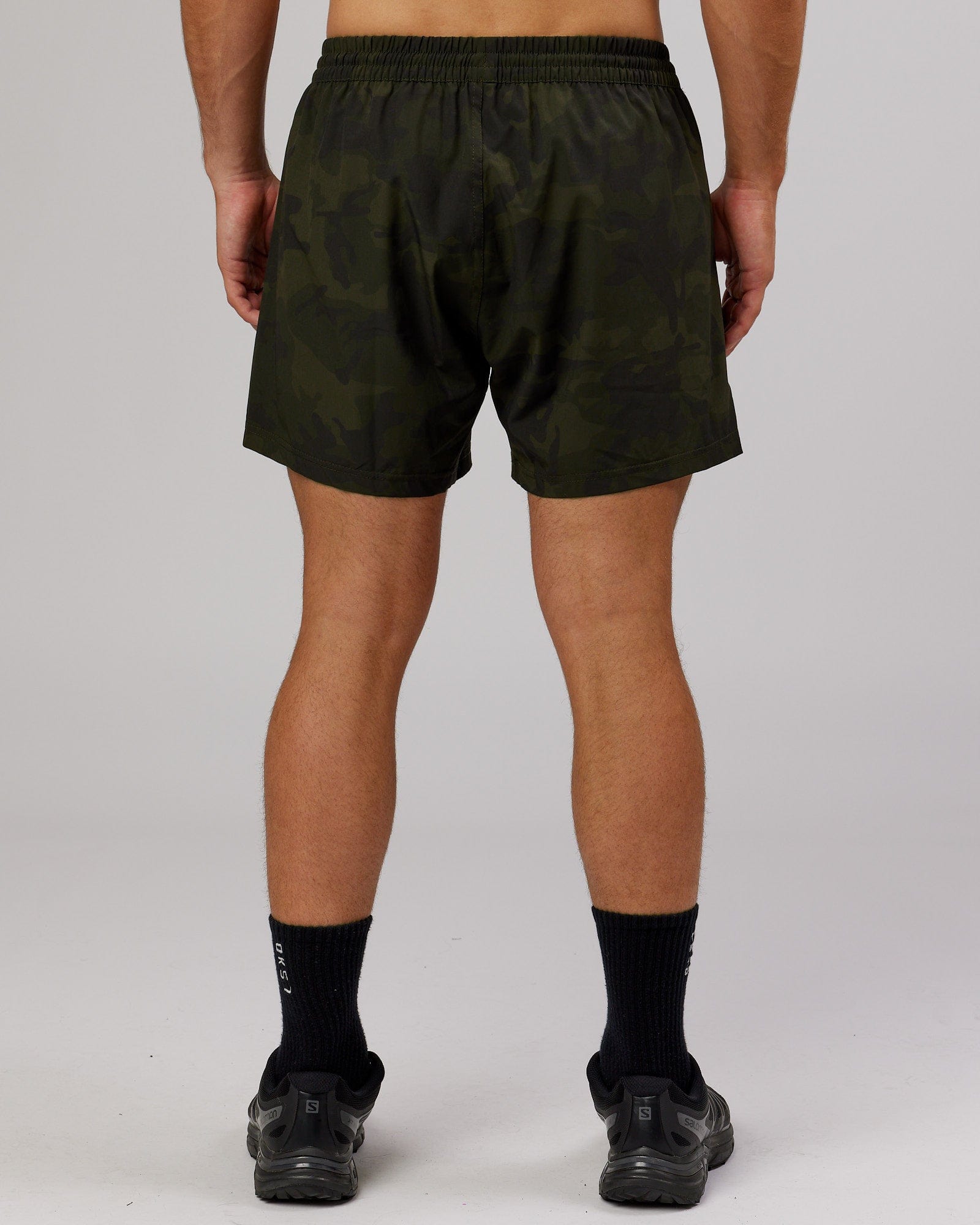 Model wearing Rep 5" Performance Short - Dark Olive Camo