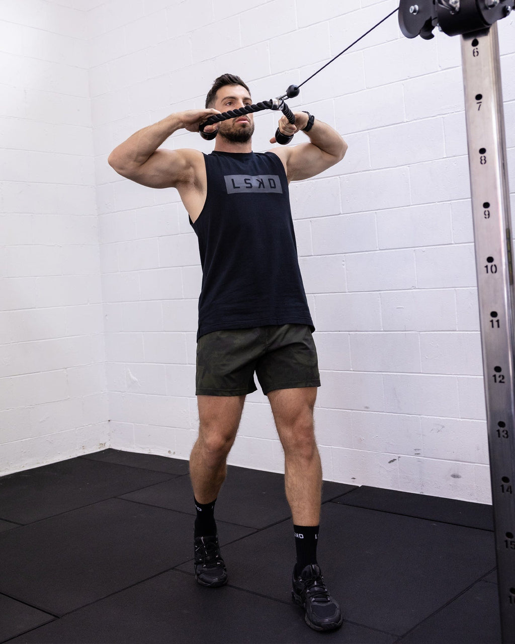 Model wearing Rep 5" Performance Short - Dark Olive Camo