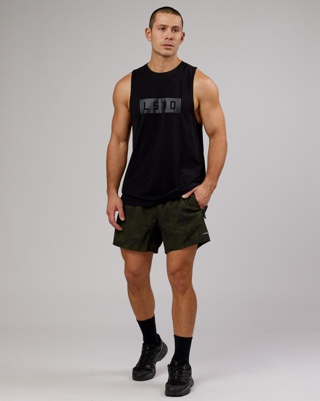 Model wearing Rep 5" Performance Short - Dark Olive Camo