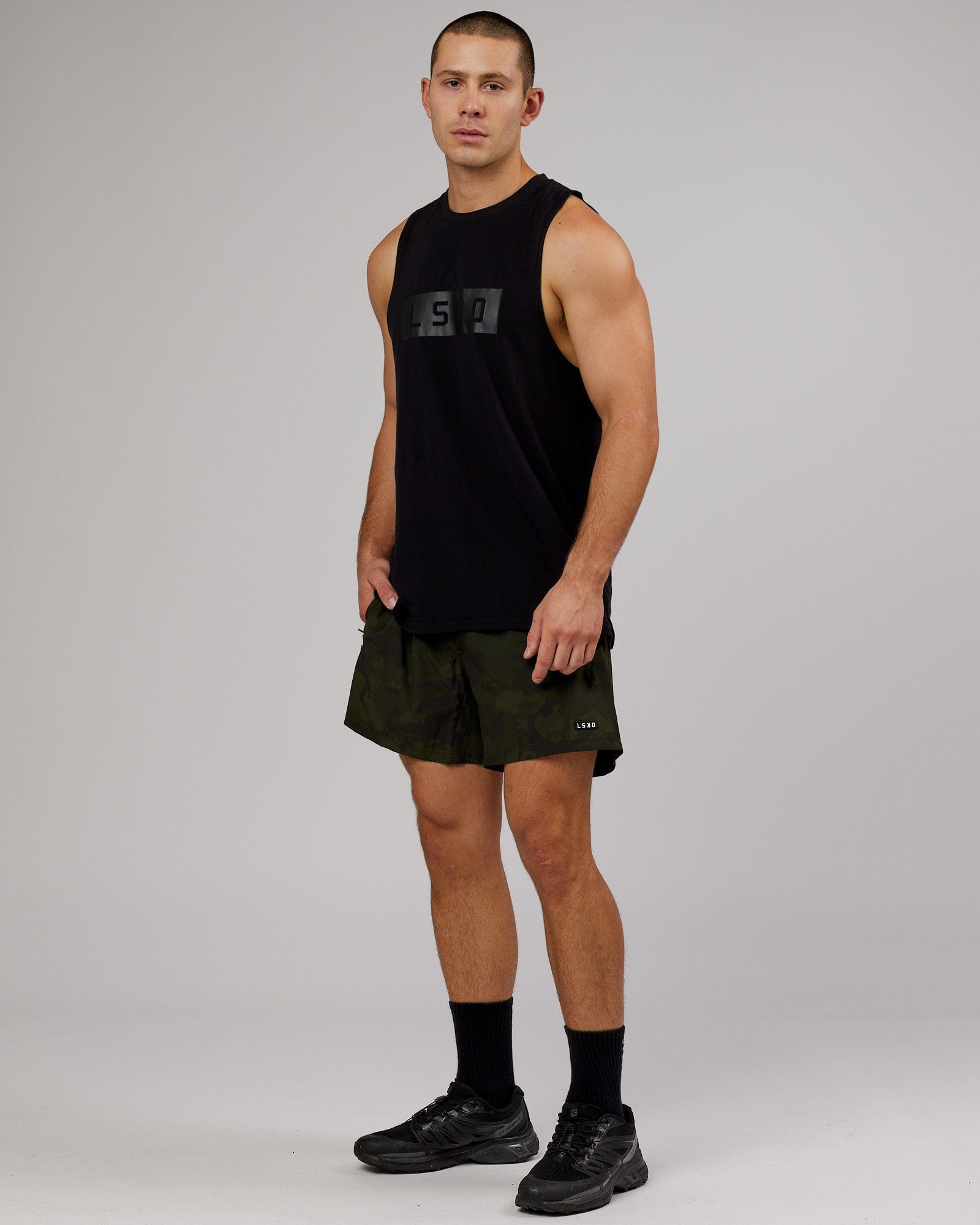 Model wearing Rep 5" Performance Short - Dark Olive Camo