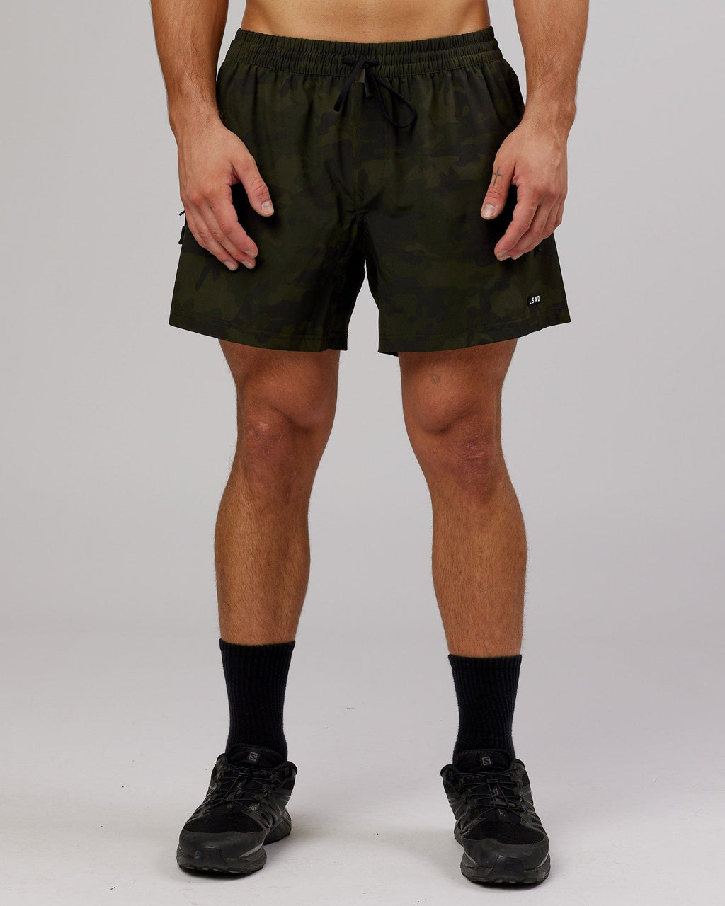Model wearing Rep 5" Performance Short - Dark Olive Camo