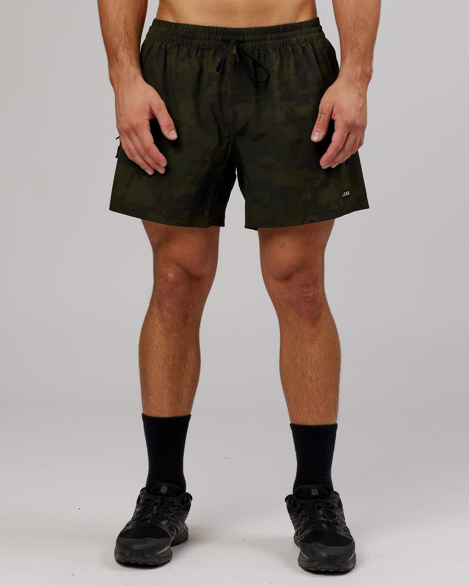 Model wearing Rep 5" Performance Short - Dark Olive Camo
