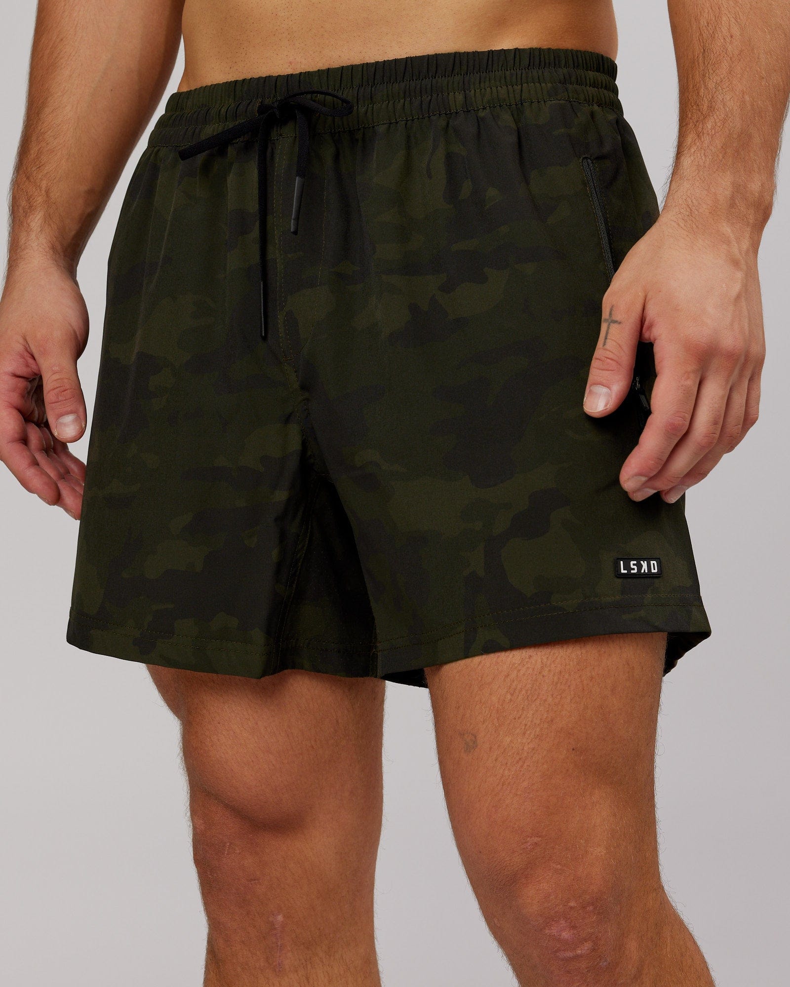 Model wearing Rep 5" Performance Short - Dark Olive Camo