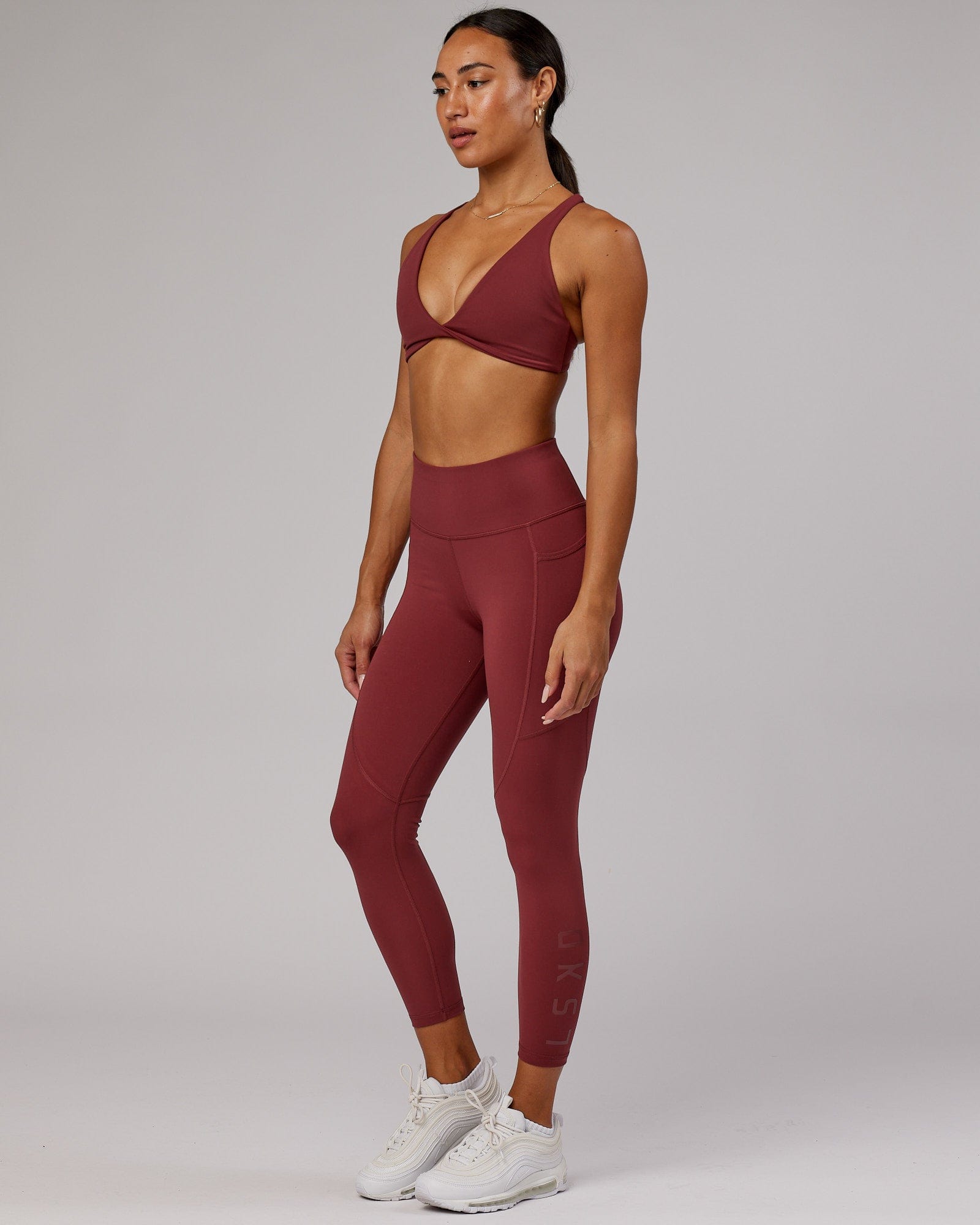 Model wearing Rep 7/8 Length Tight - Apple Berry