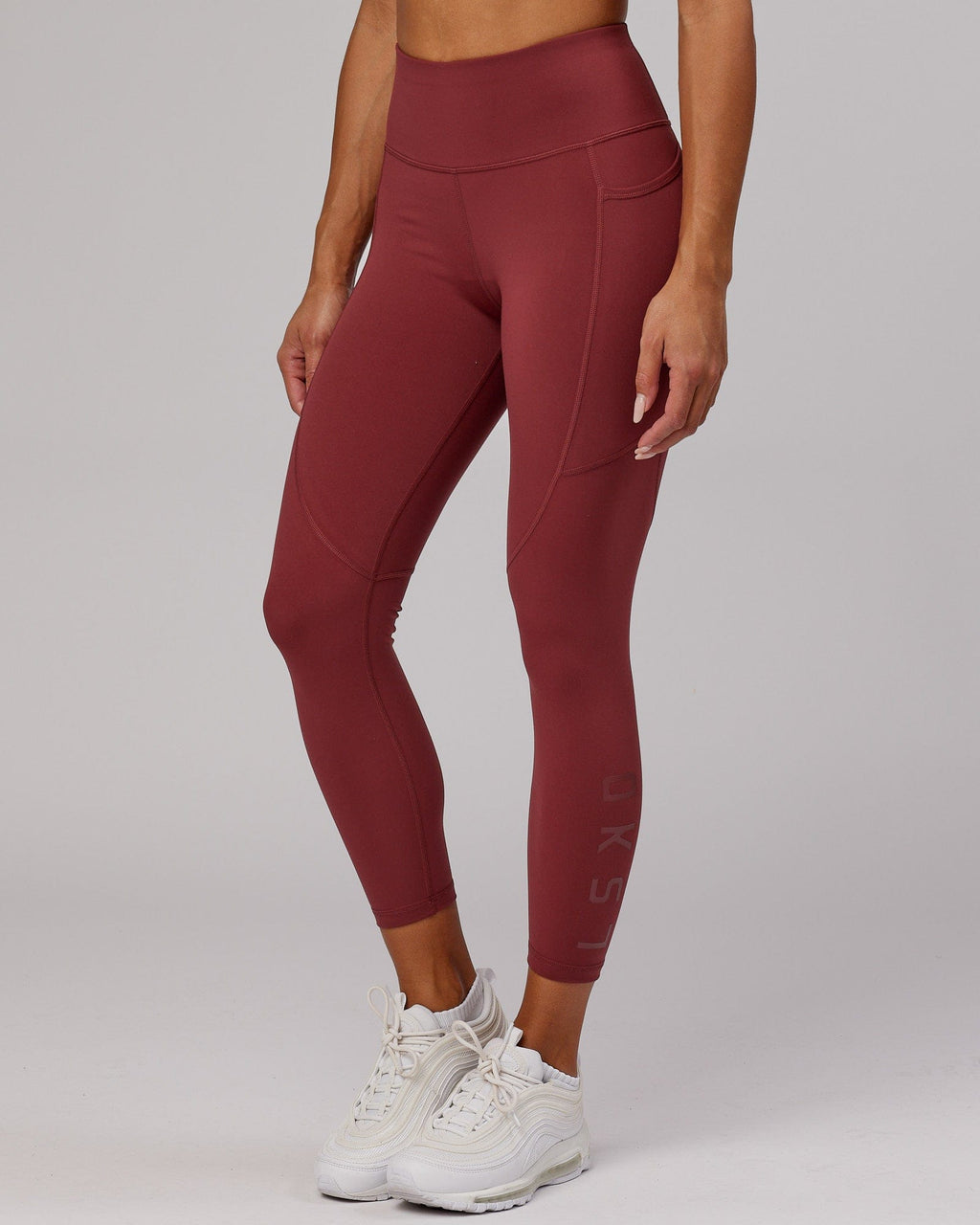 Model wearing Rep 7/8 Length Tight - Apple Berry