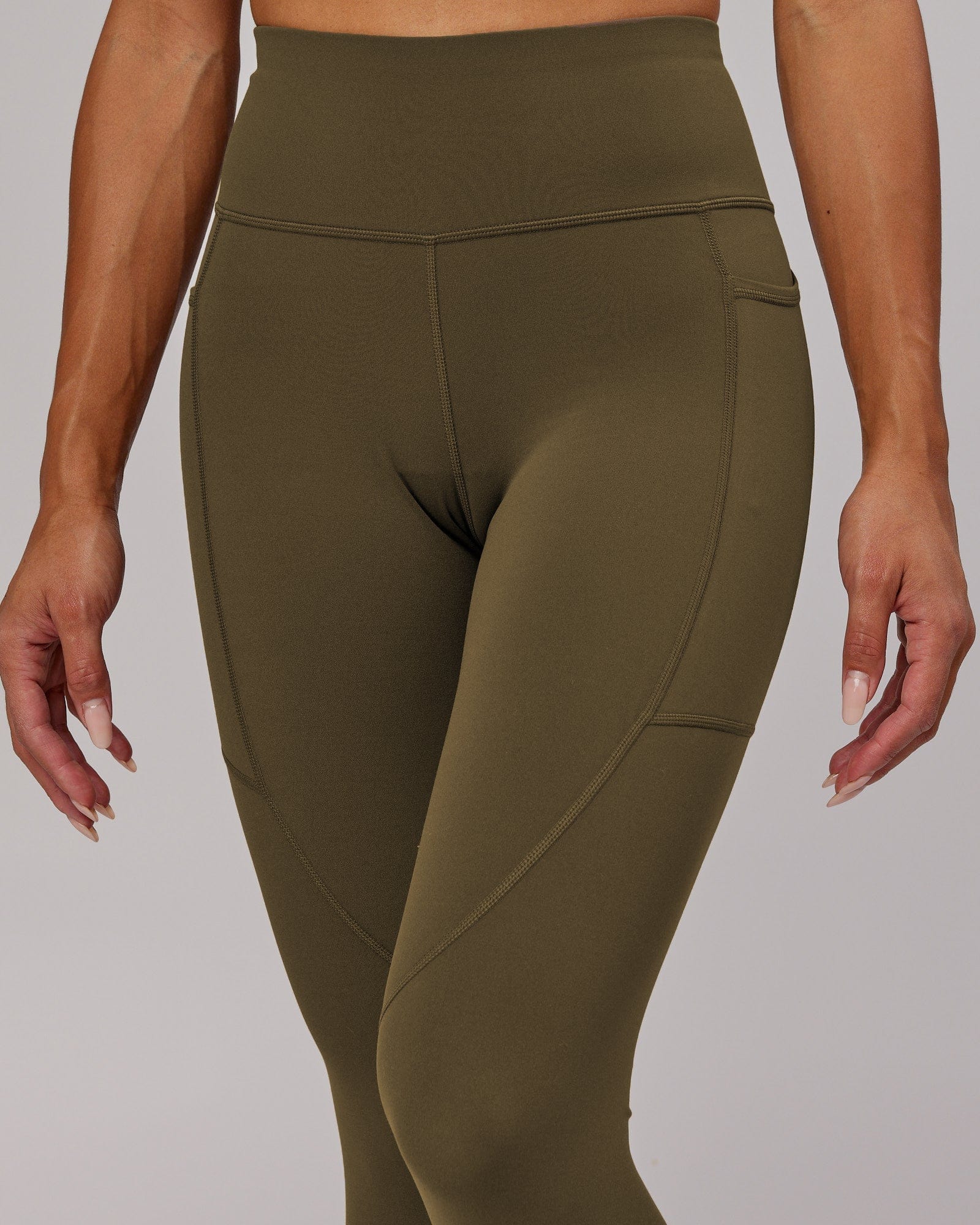 Model wearing Rep 7/8 Length Tight - Army Green