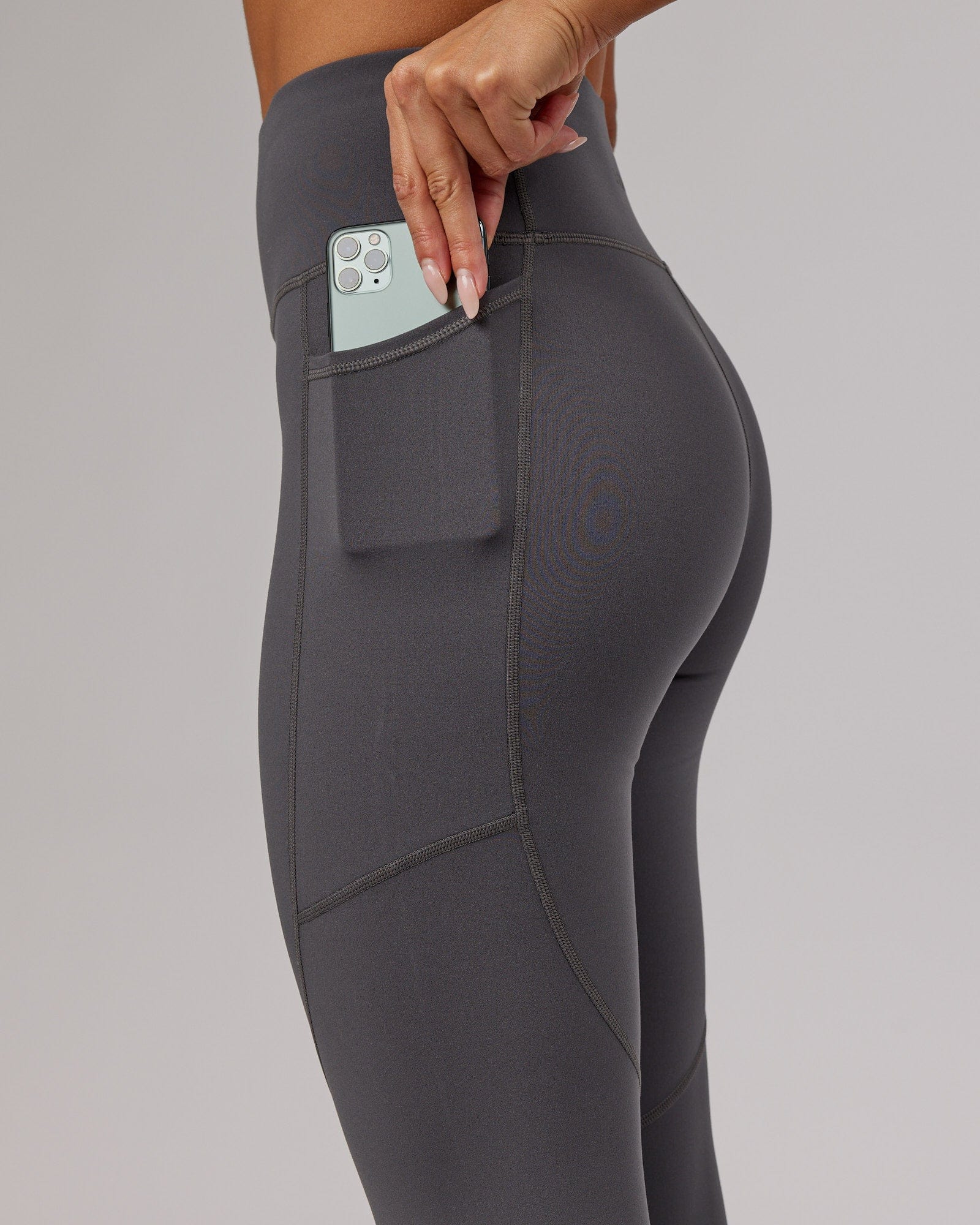 Model wearing Rep 7/8 Length Tight - Asphalt