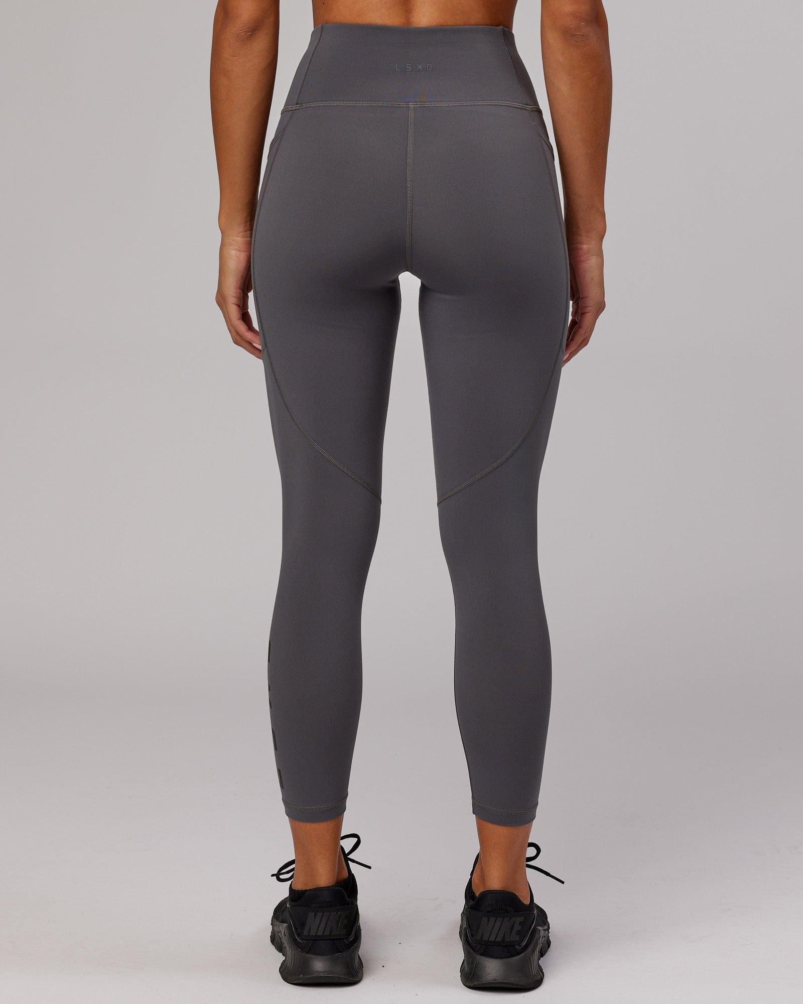 Model wearing Rep 7/8 Length Tight - Asphalt