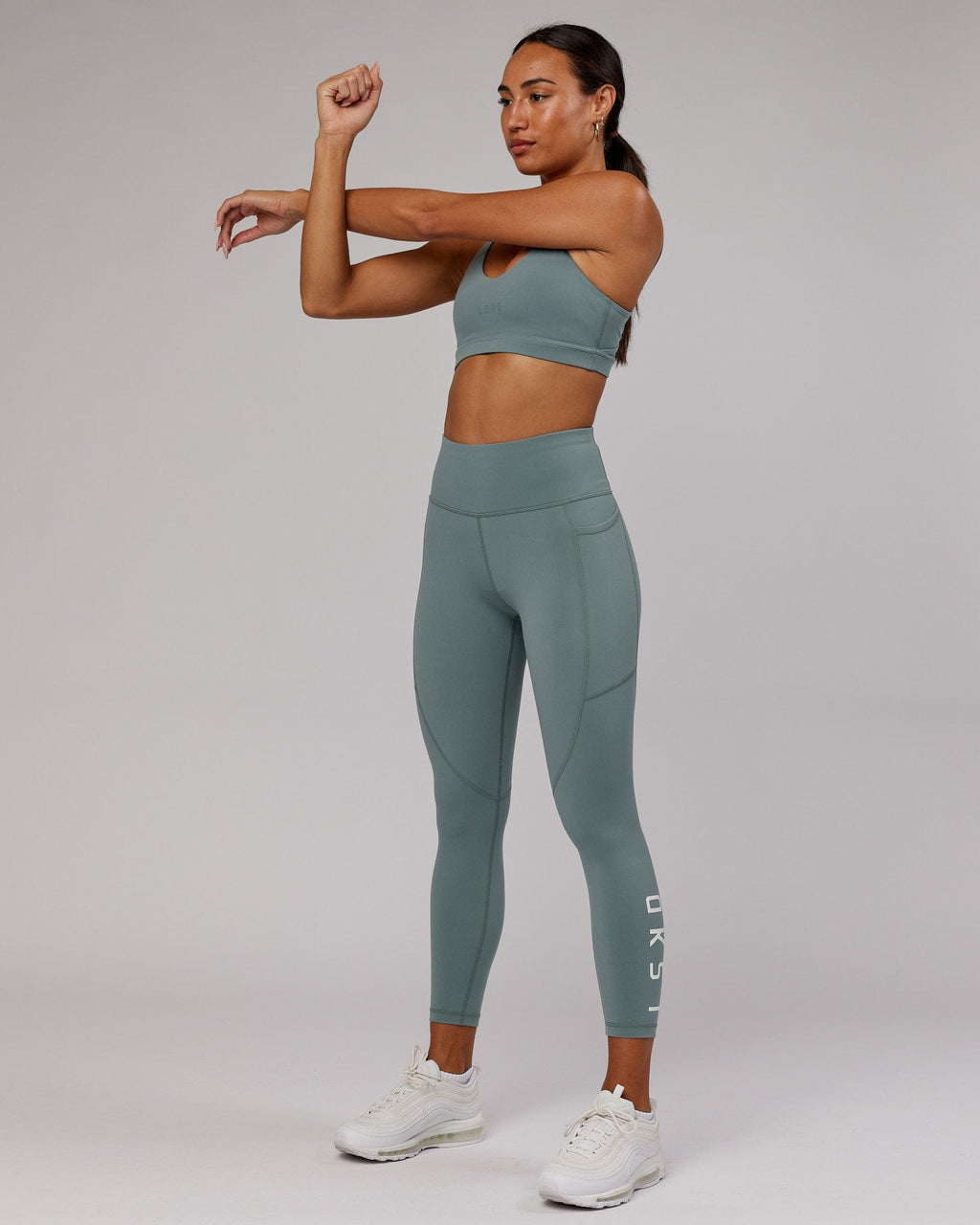 Model wearing Rep 7/8 Length Tight - Eclipse