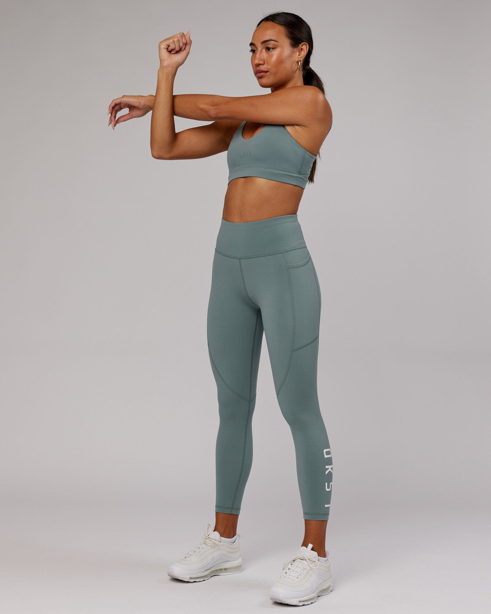 Model wearing Rep 7/8 Length Tight - Eclipse