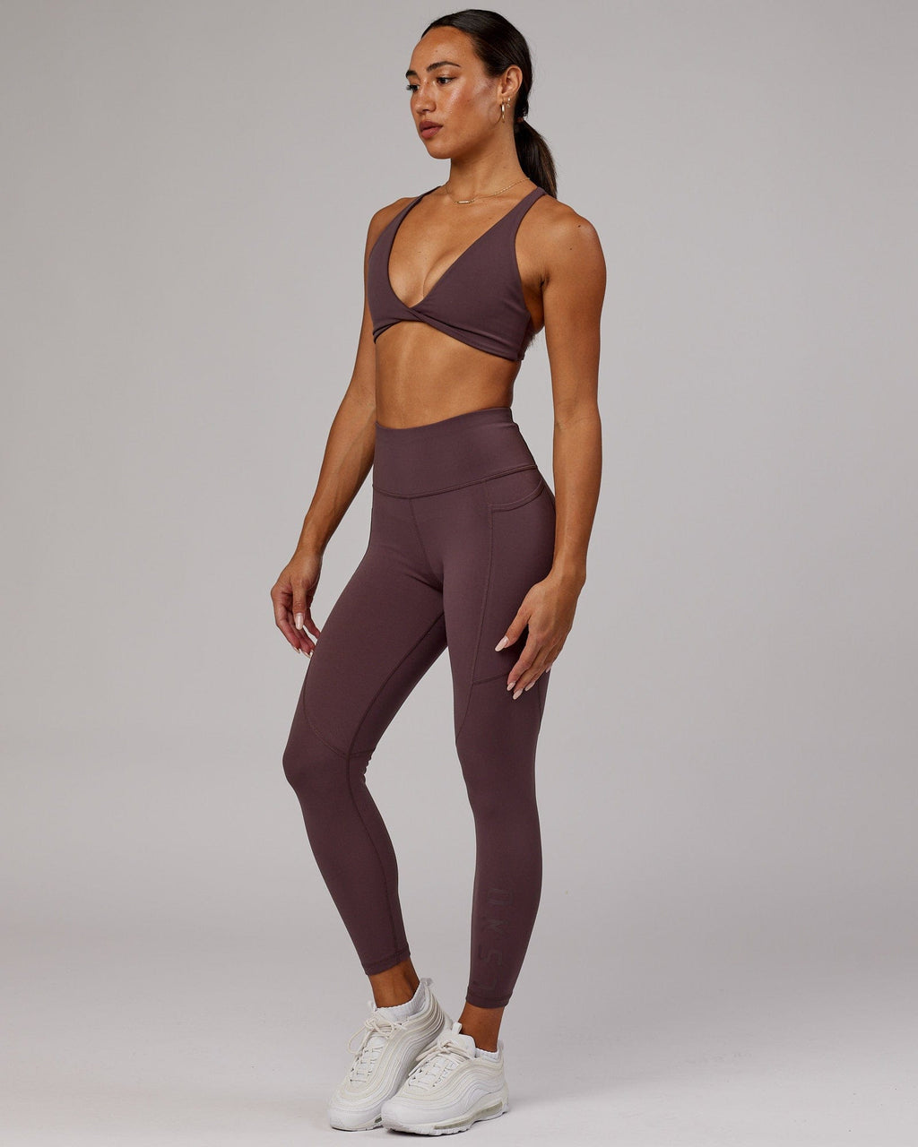 Model wearing Rep 7/8 Length Tight - Plum