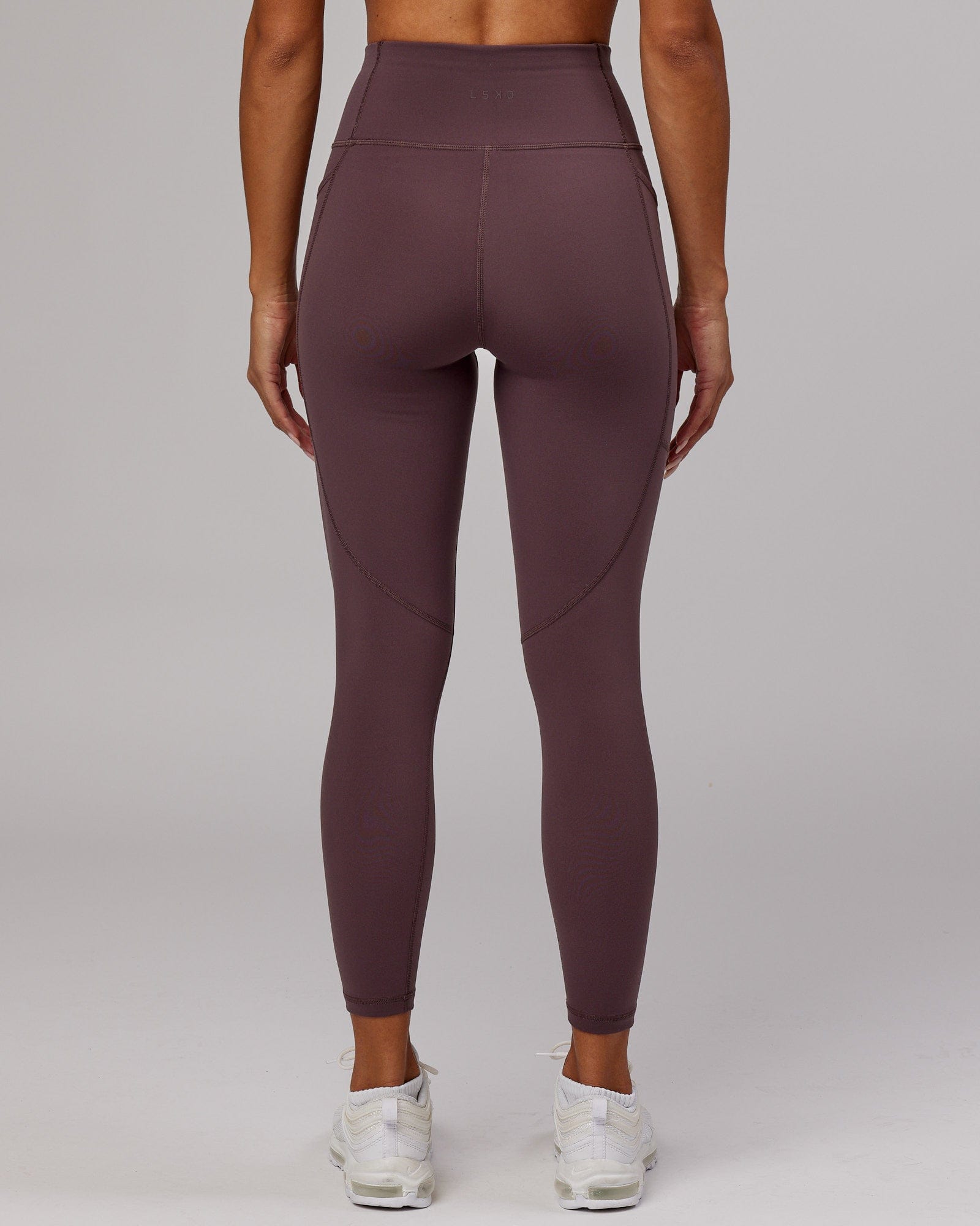 Model wearing Rep 7/8 Length Tight - Plum
