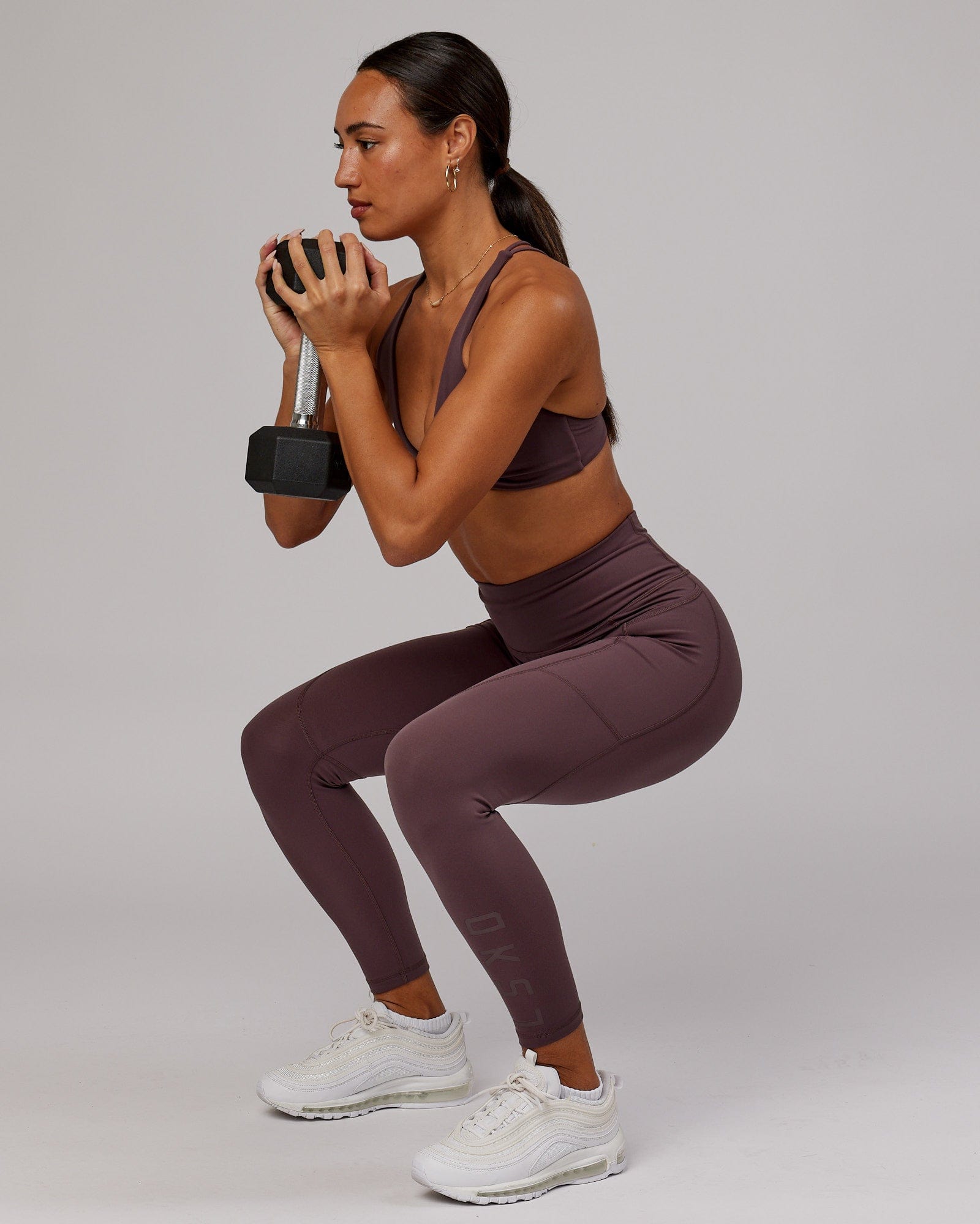 Model wearing Rep 7/8 Length Tight - Plum