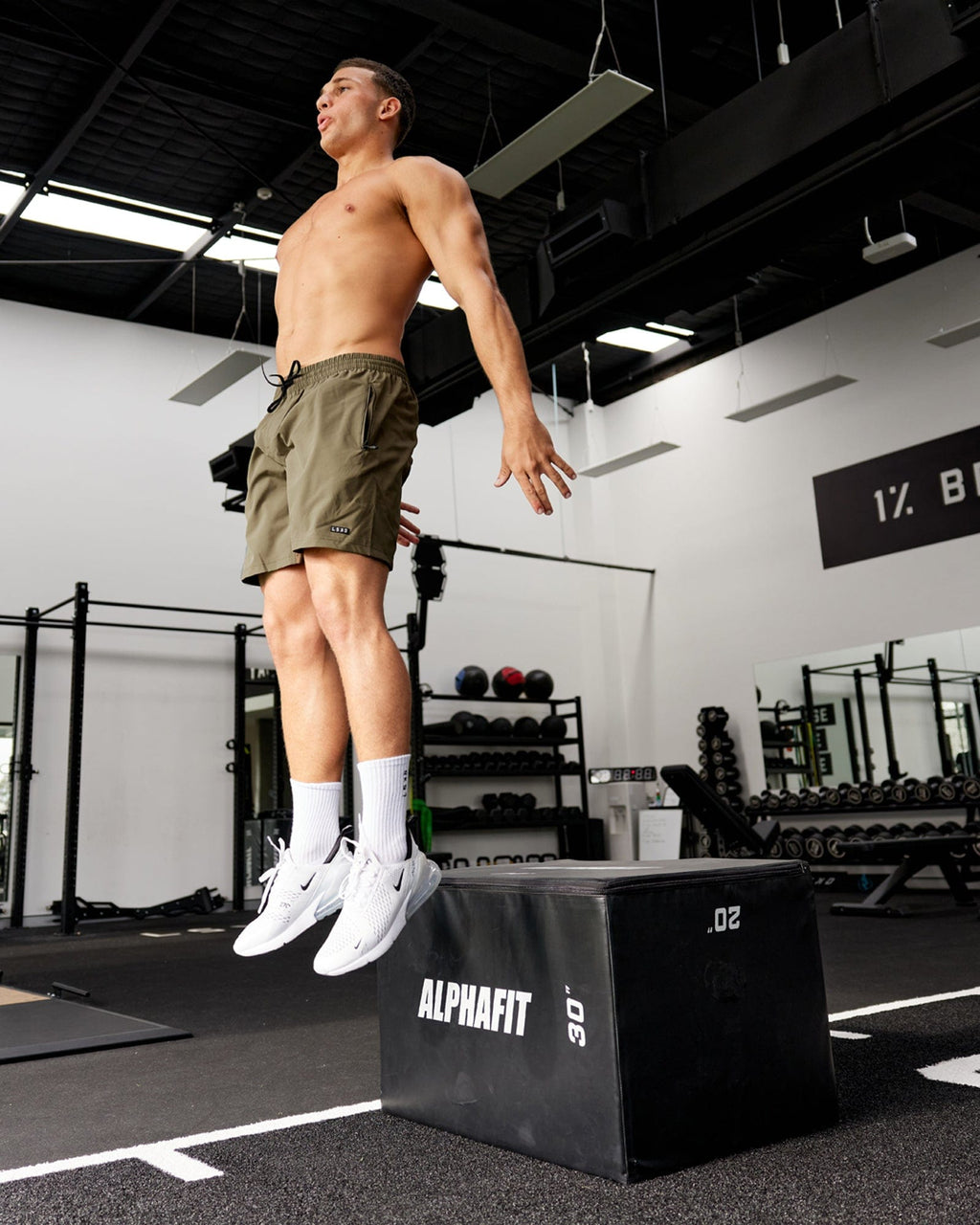 Model wearing Rep 7'' Performance Short - Army Green