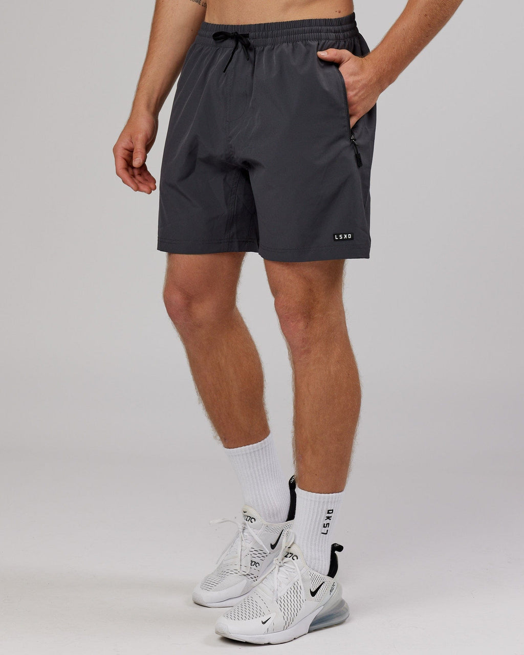Model wearing Rep 7'' Performance Short - Asphalt