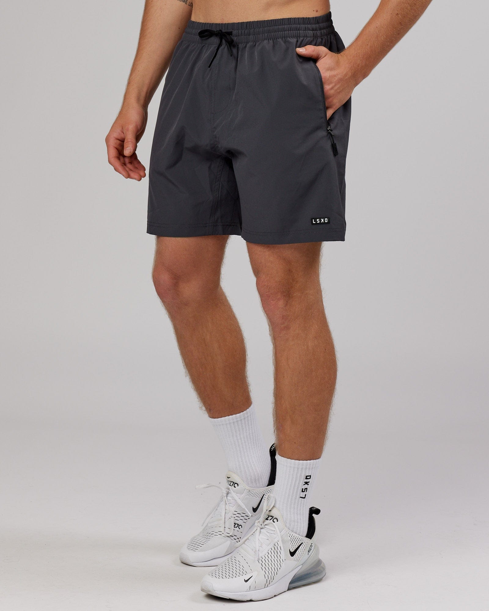 Model wearing Rep 7'' Performance Short - Asphalt