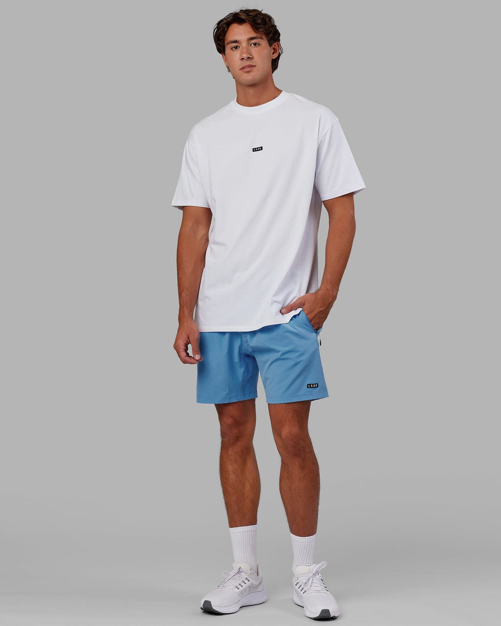 Model wearing Rep 7" Performance Short - Azure Blue