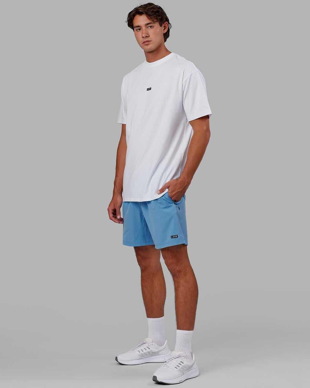 Model wearing Rep 7" Performance Short - Azure Blue