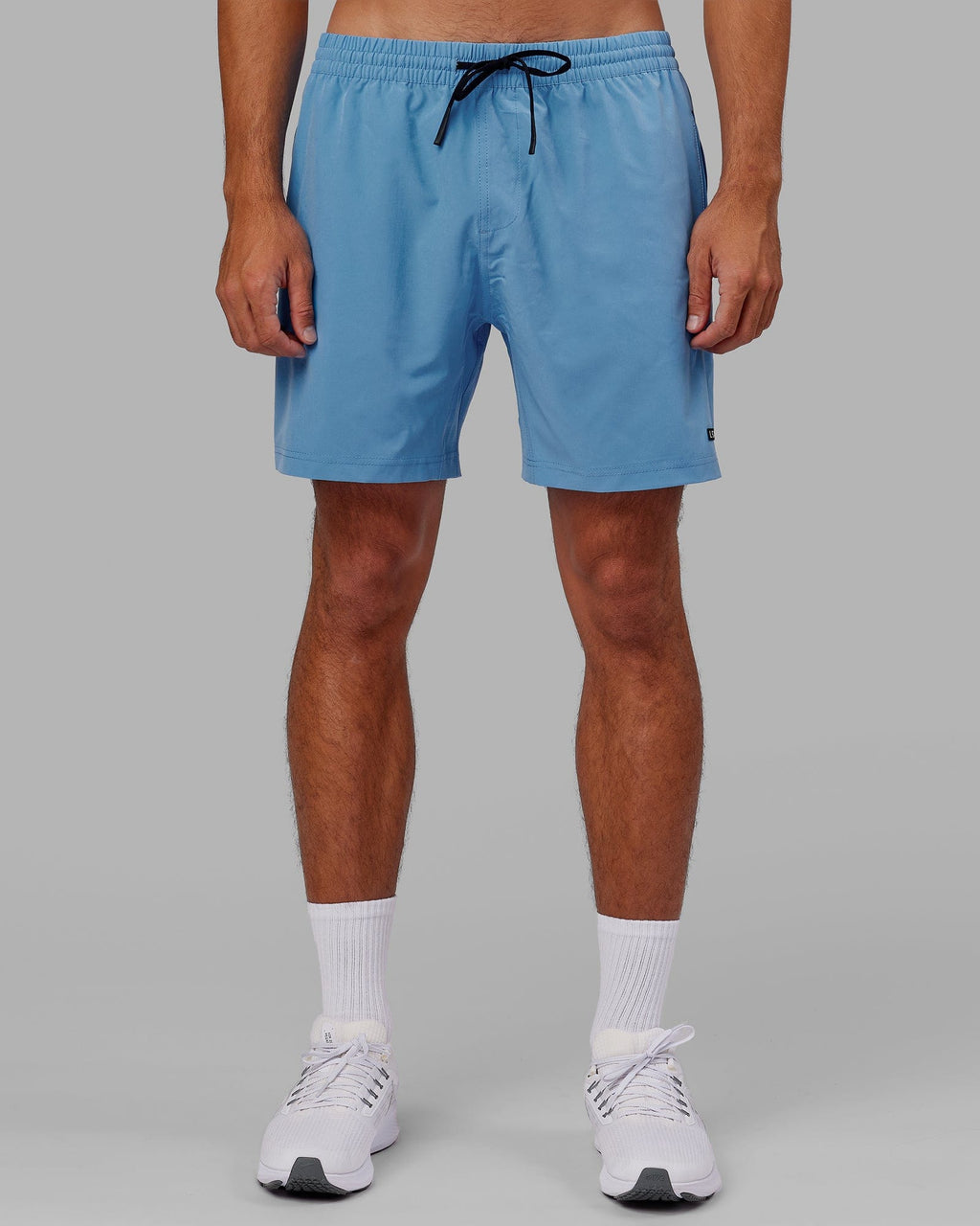 Model wearing Rep 7" Performance Short - Azure Blue
