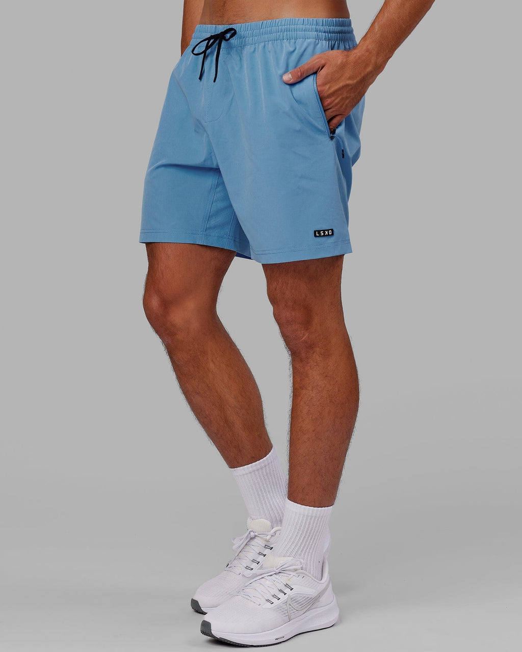 Model wearing Rep 7" Performance Short - Azure Blue