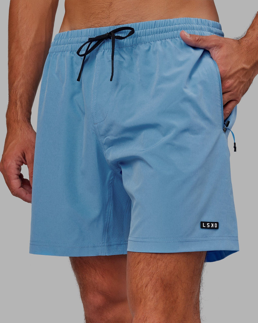 Model wearing Rep 7" Performance Short - Azure Blue