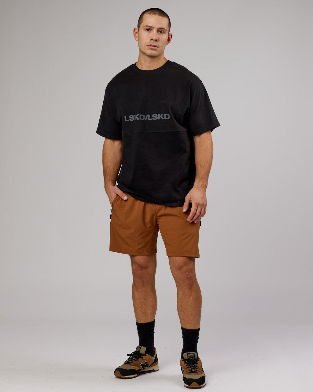 Model wearing Rep 7'' Performance Short - Camel