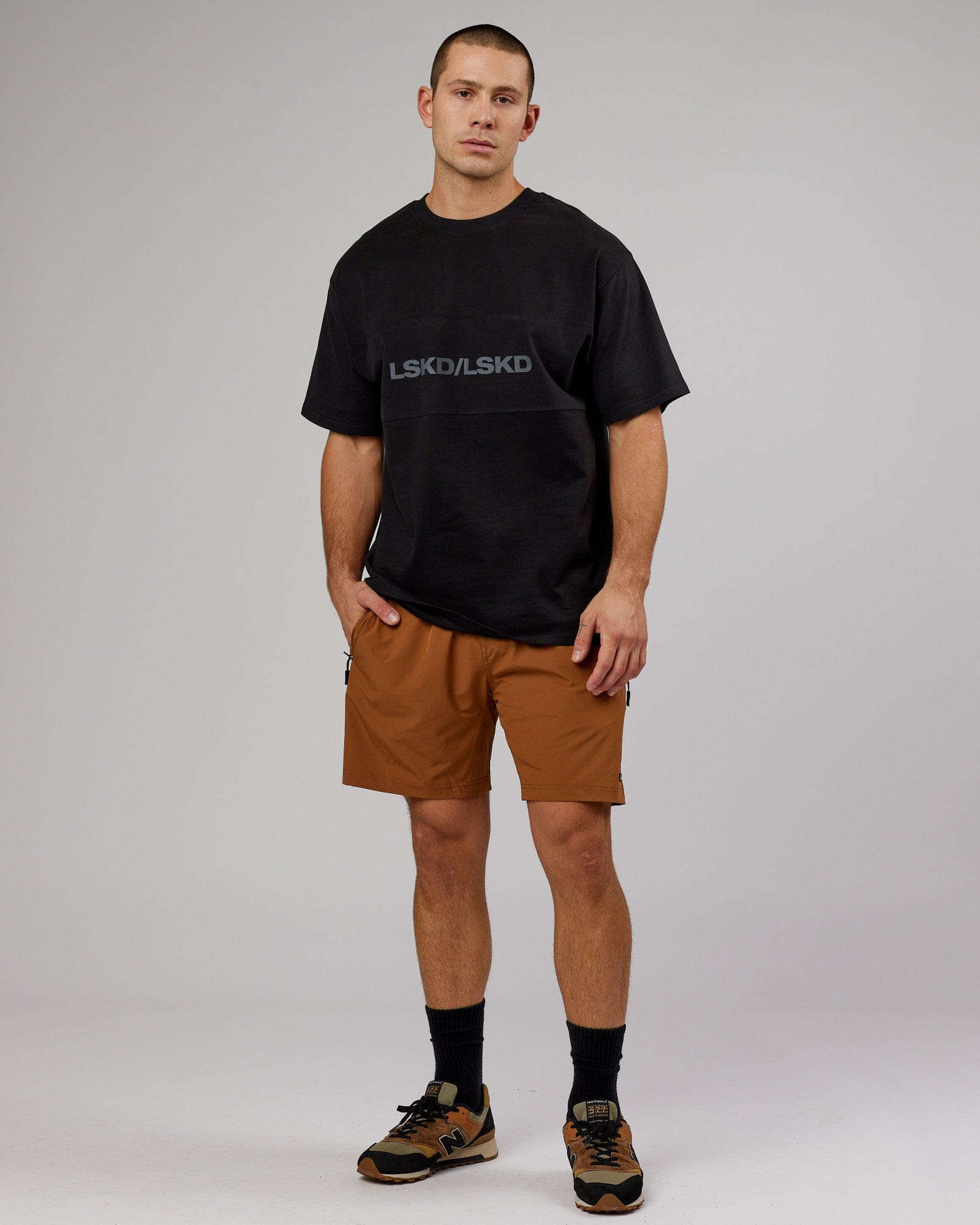Model wearing Rep 7'' Performance Short - Camel