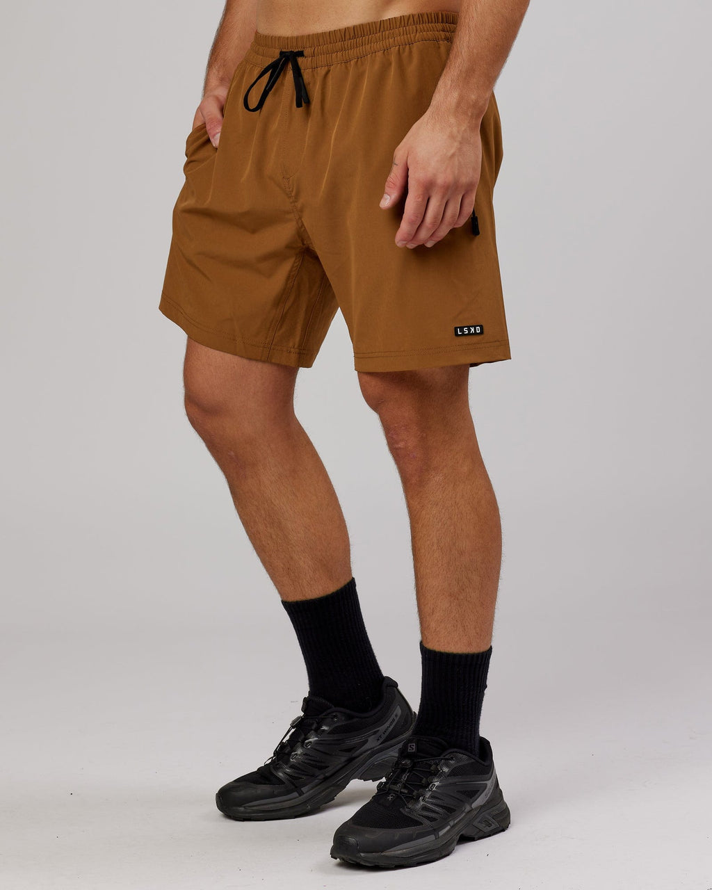 Model wearing Rep 7'' Performance Short - Camel