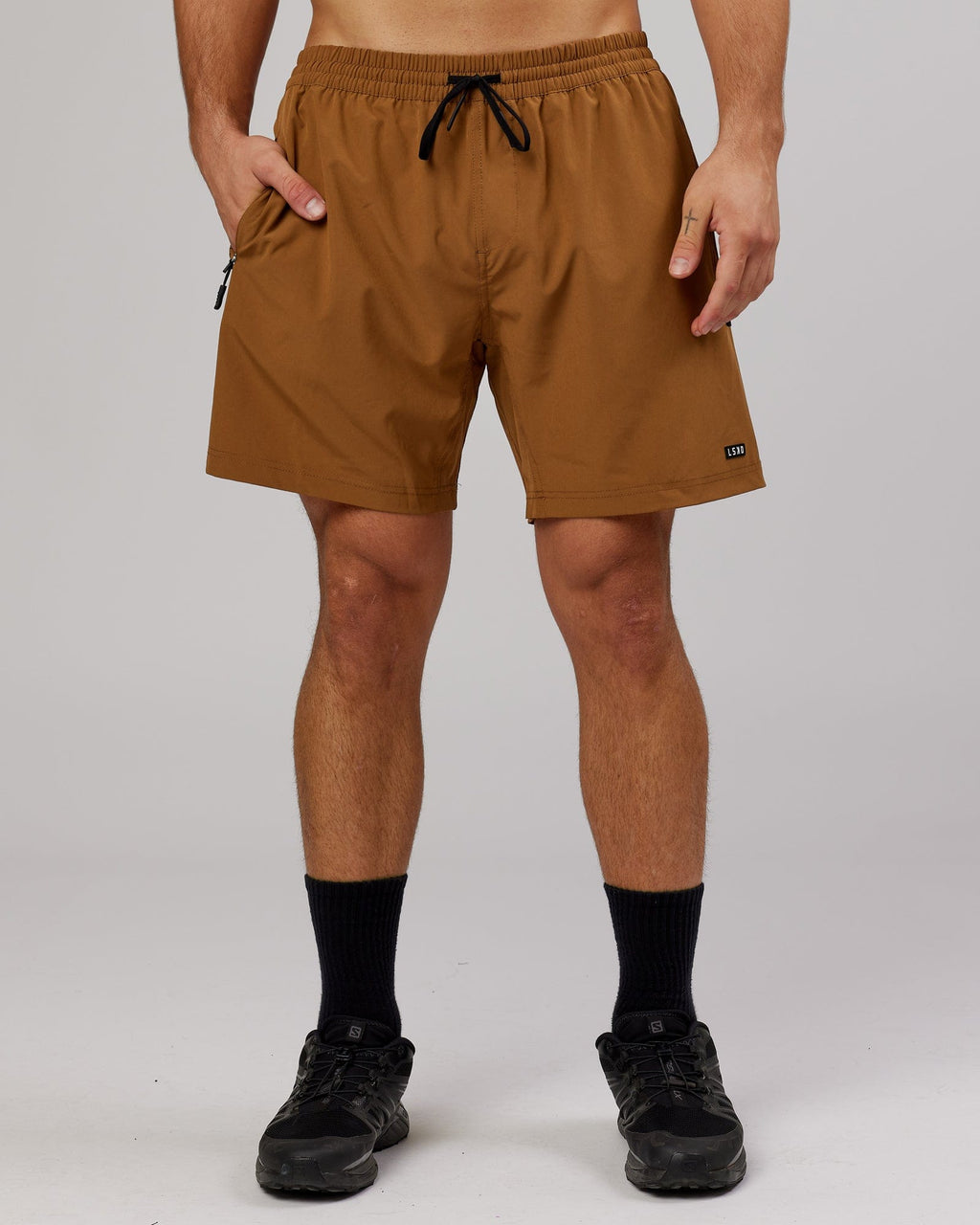 Model wearing Rep 7'' Performance Short - Camel