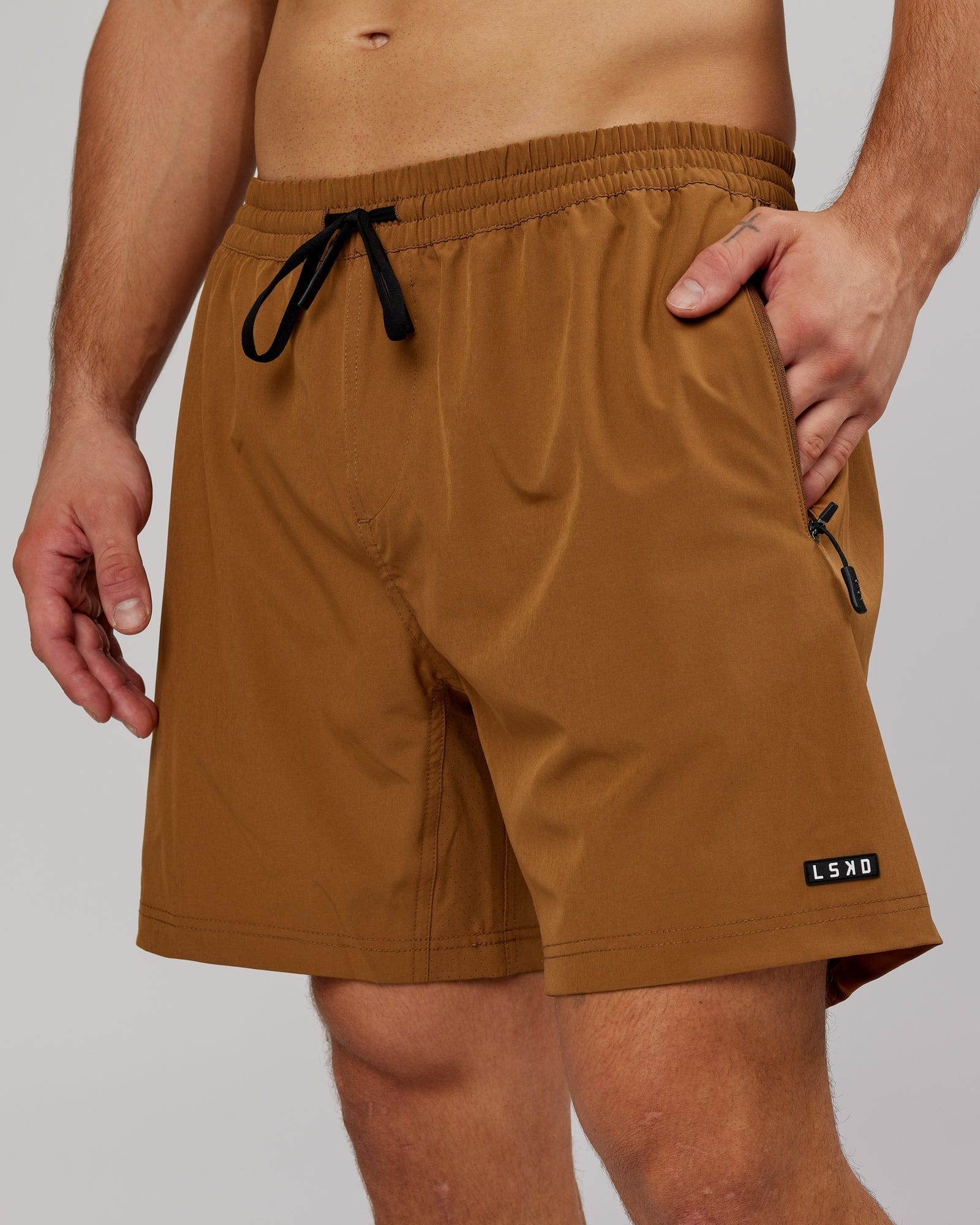 Model wearing Rep 7'' Performance Short - Camel