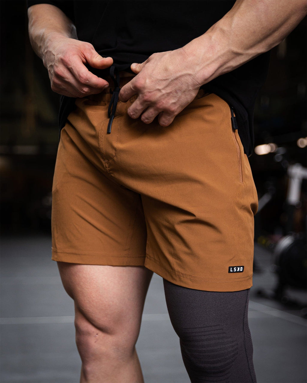 Model wearing Rep 7'' Performance Short - Camel
