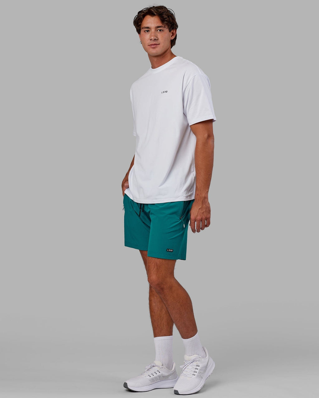 Model wearing Rep 7" Performance Short - Deep Lake