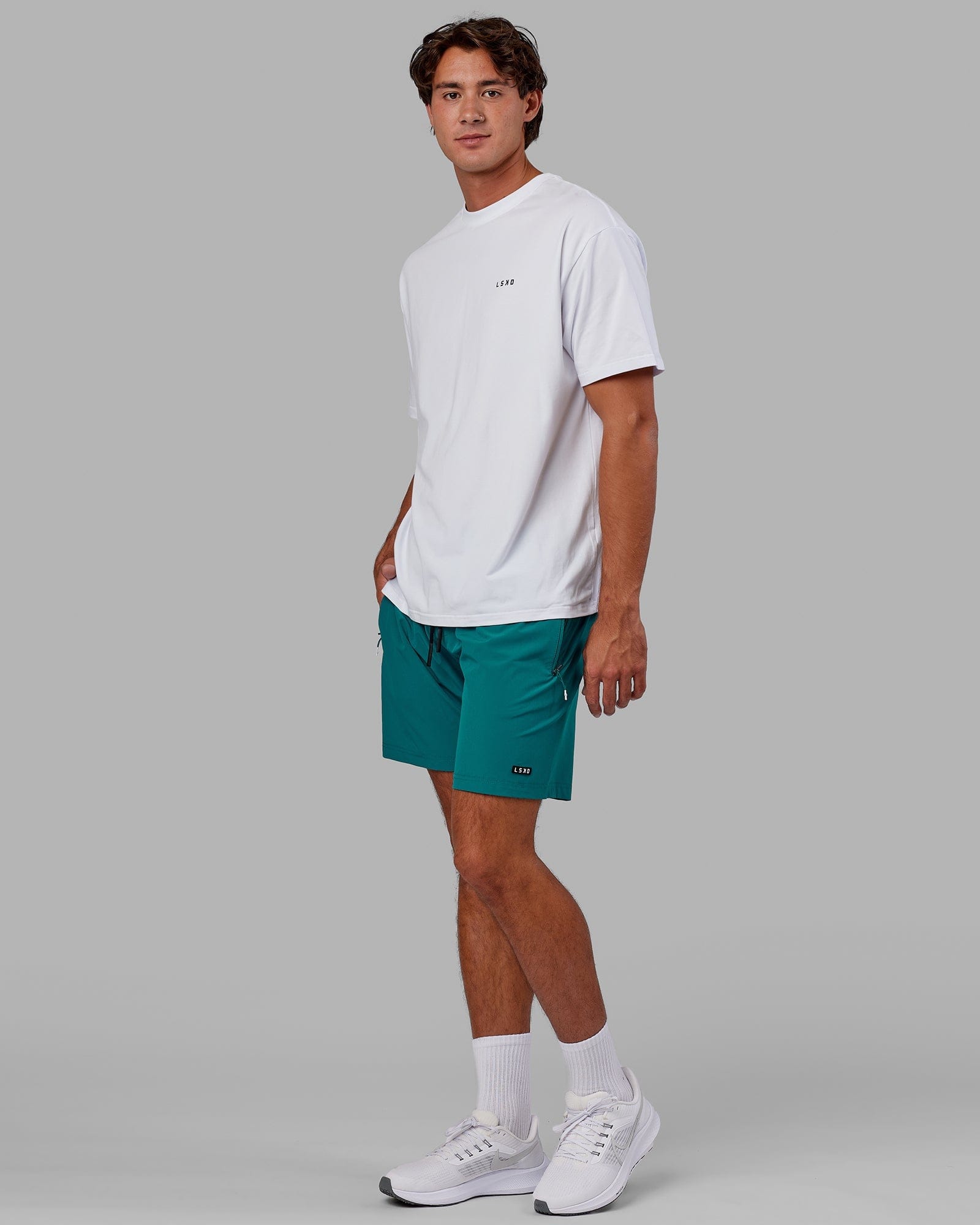 Model wearing Rep 7" Performance Short - Deep Lake