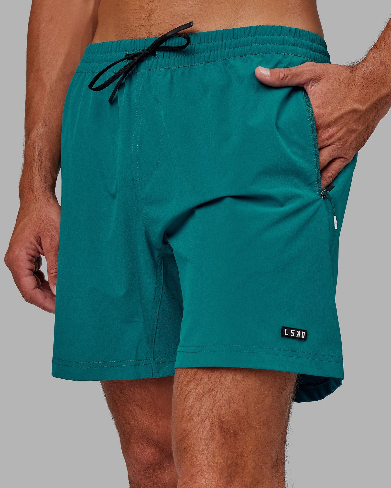 Model wearing Rep 7" Performance Short - Deep Lake