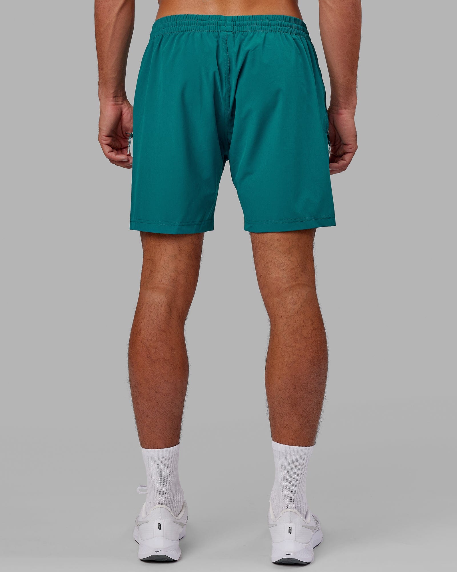 Model wearing Rep 7" Performance Short - Deep Lake