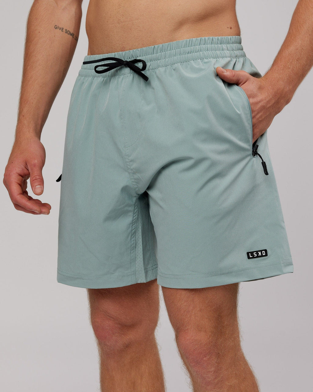 Model wearing Rep 7'' Performance Short - Frost